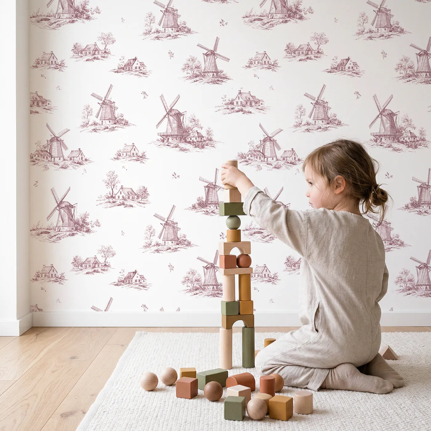 Windmill Toile Rows in Pink wallpaper in a cozy kids room - Whimsy Tots