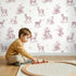 Deer Toile Toss in Pink wallpaper in a cozy kids room - Whimsy Tots