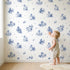 Pastoral Toile Toss wallpaper in a cozy kids room - Whimsy Tots