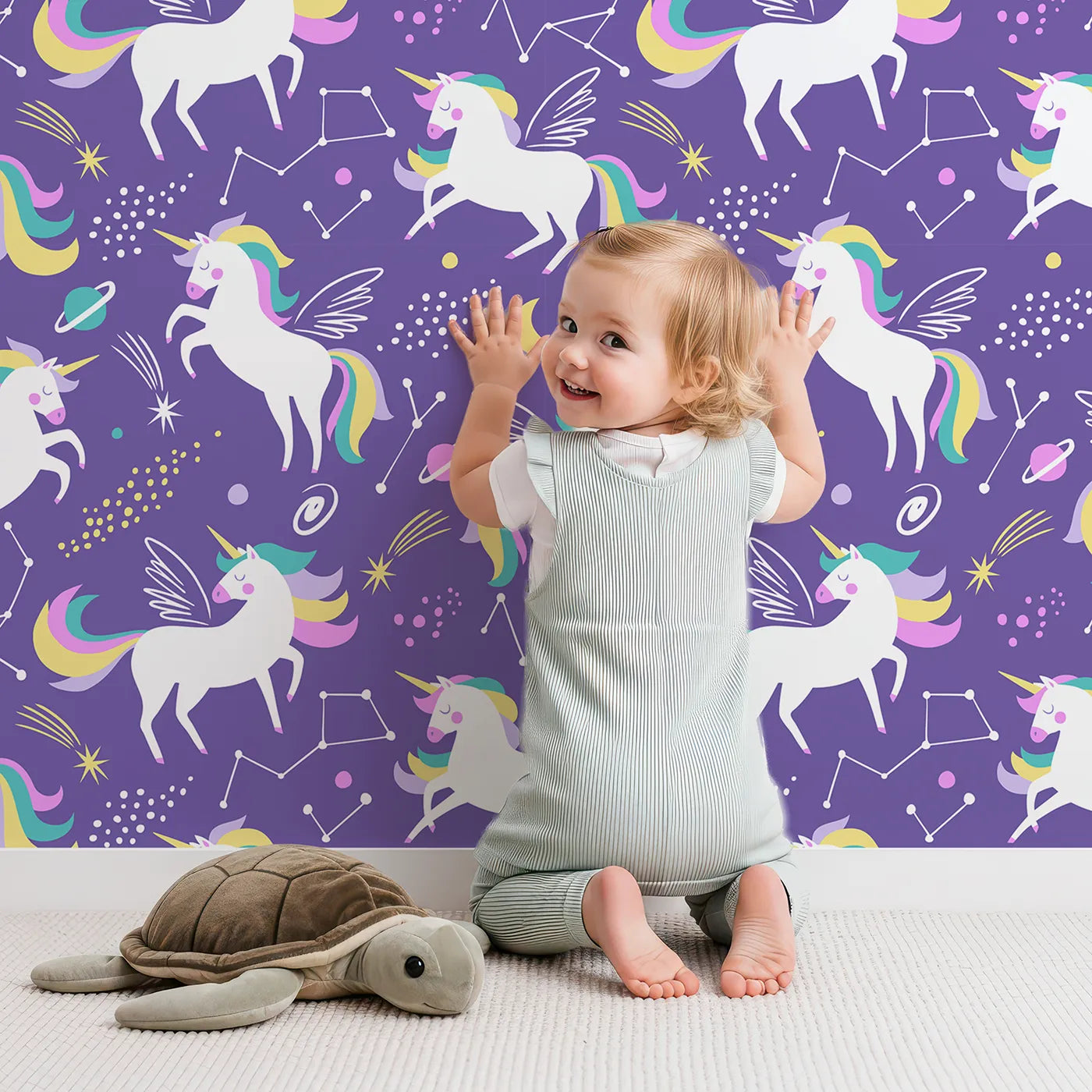 Lovely child standing in front of Whimsy Tots Cosmic Unicorn Galaxy Wallpaper in Purple with unicorn, pegasus, space, star, planet in design.