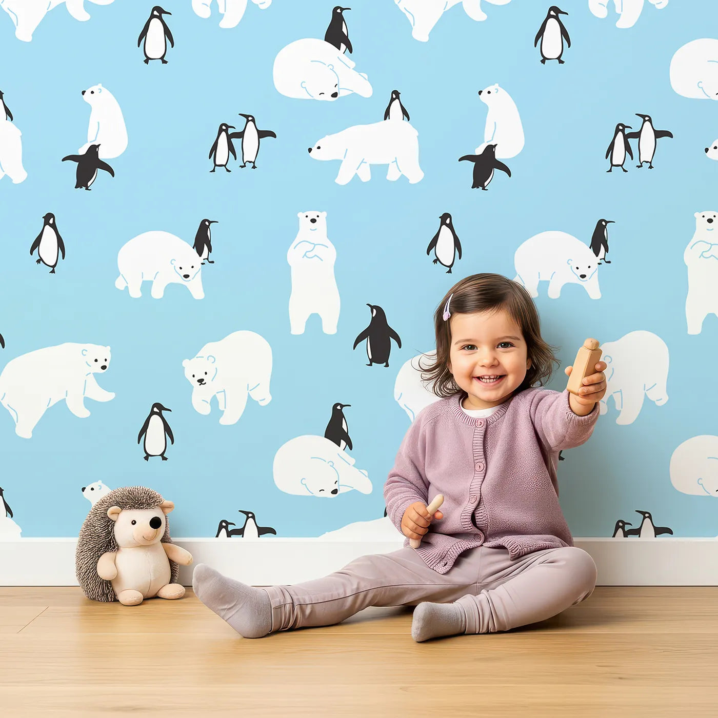Lovely child standing in front of Whimsy Tots Polar Bear and Penguin Pals Wallpaper with polar bear, penguin, arctic, animal, snow in design.