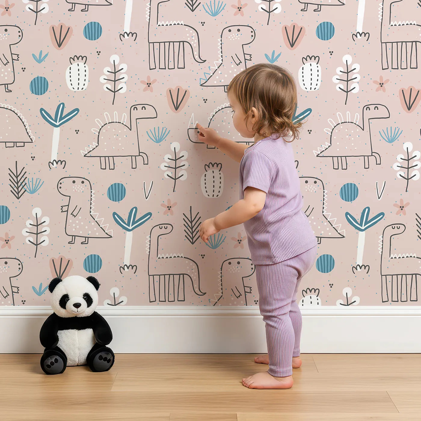 Lovely child standing in front of Whimsy Tots Boho Dino Doodle Wallpaper in Pink with dinosaur, boho, botanical, minimalist, sketch in design.