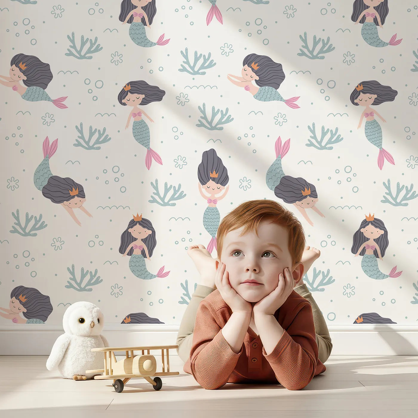 Lovely child standing in front of Whimsy Tots Mermaid Princess Dreams Wallpaper with mermaid, princess, ocean, sea, coral in design.