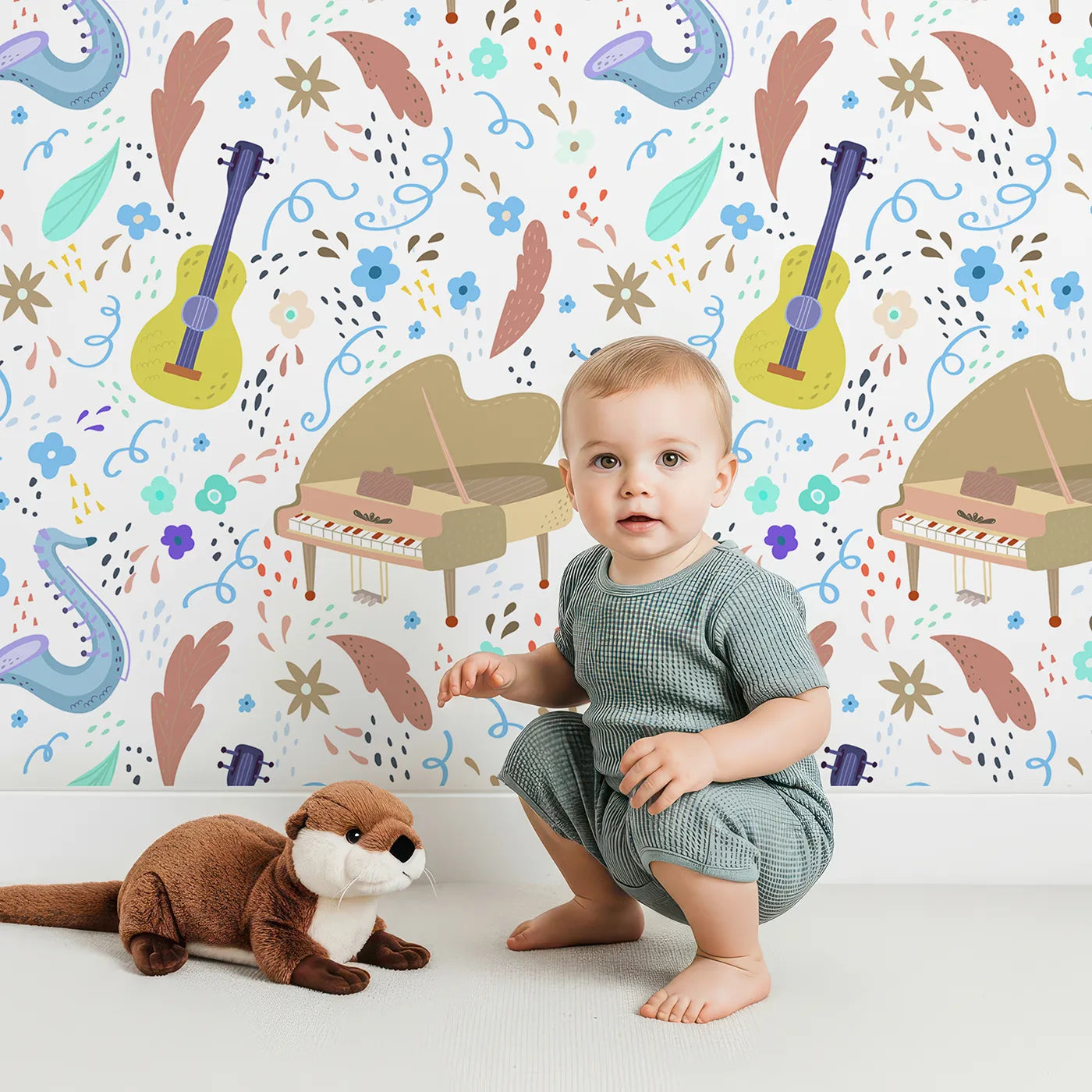 Lovely child standing in front of Whimsy Tots Musical Meadow Wallpaper with music, piano, sax, guitar, flower in design.