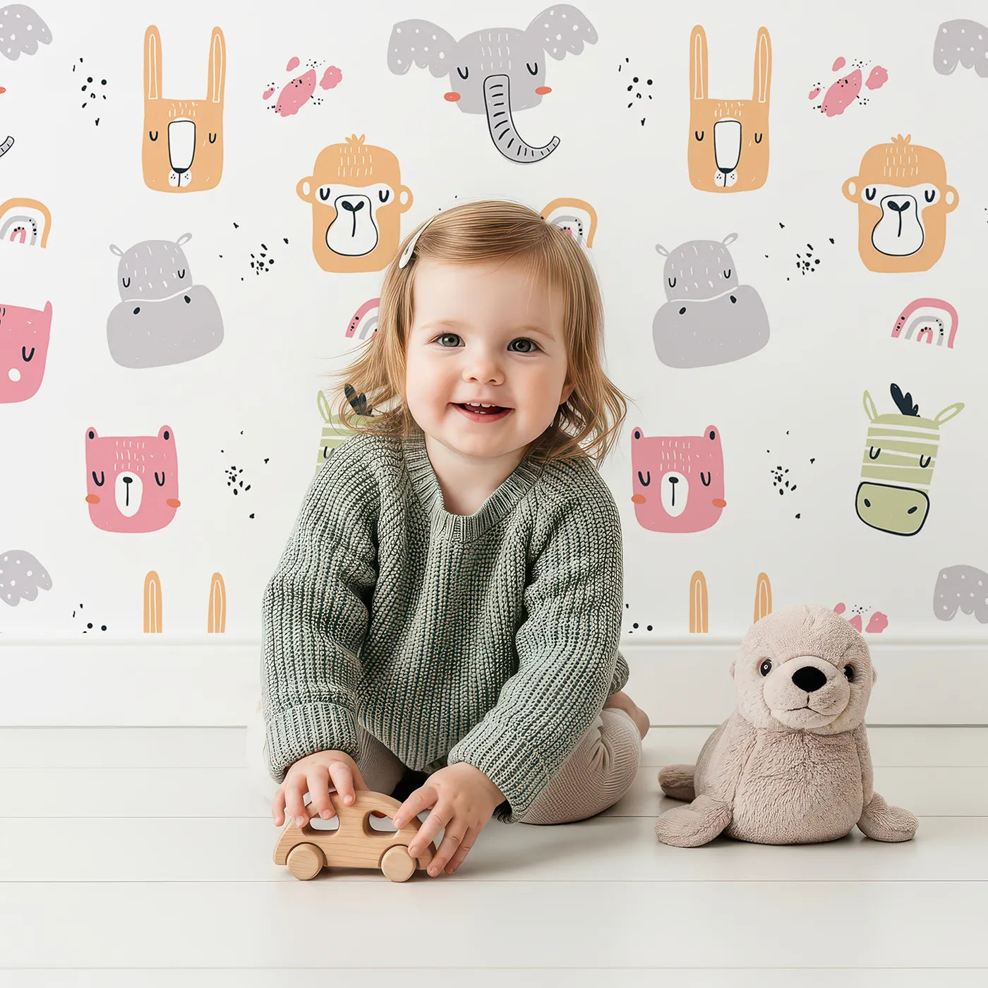 Lovely child standing in front of Whimsy Tots Safari Rainbow Friends Wallpaper with safari, animal, face, rainbow, cute in design.
