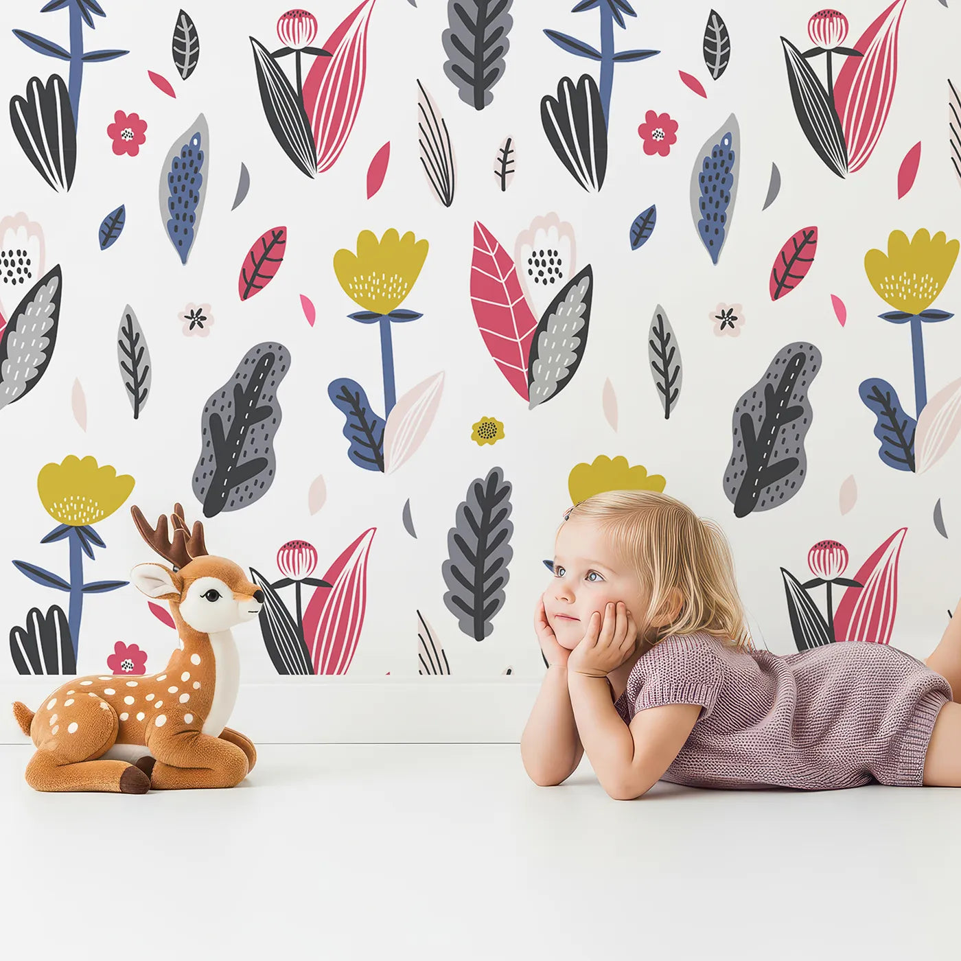 Lovely child standing in front of Whimsy Tots Modern Folk Art Floral Wallpaper with flower, floral, abstract, modern, folk art in design.