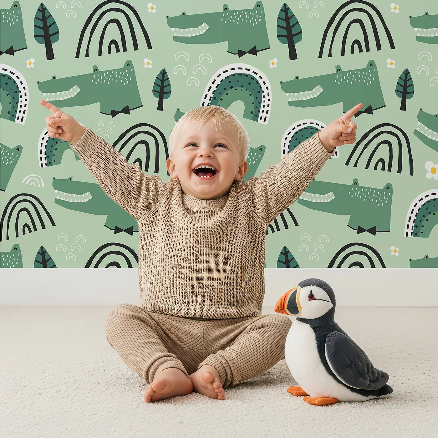 Lovely child standing in front of Whimsy Tots Crocodile Rainbow Party Wallpaper in Green with crocodile, alligator, rainbow, modern, green in design.