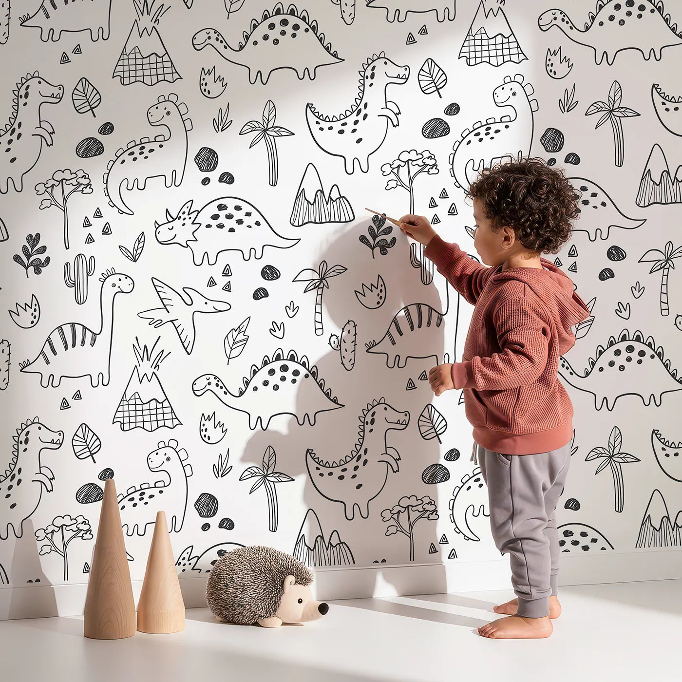 Lovely child standing in front of Whimsy Tots Dinosaur Doodle Land Wallpaper with dinosaur, doodle, sketch, volcano, coloring book in design.