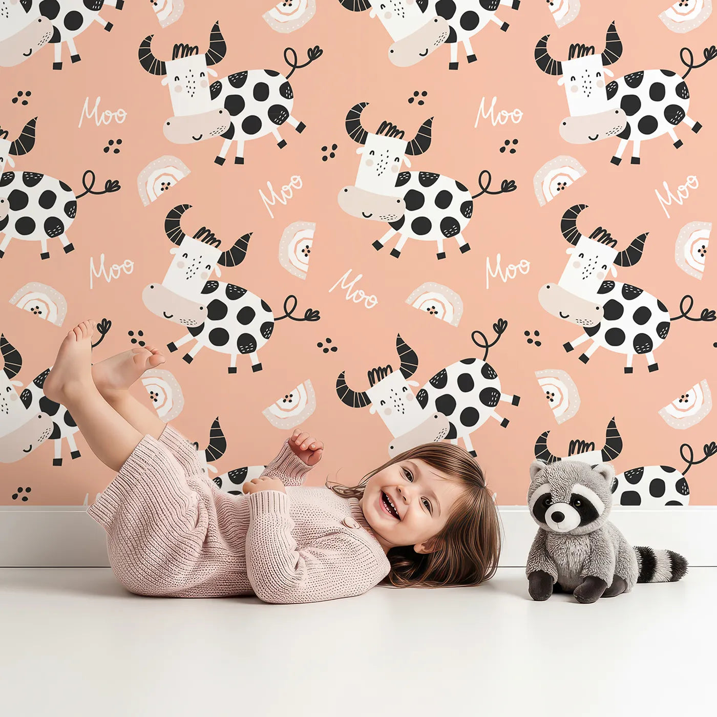 Lovely child standing in front of Whimsy Tots Happy Moo Cow Wallpaper with cow, farm, moo, rainbow, animal in design.