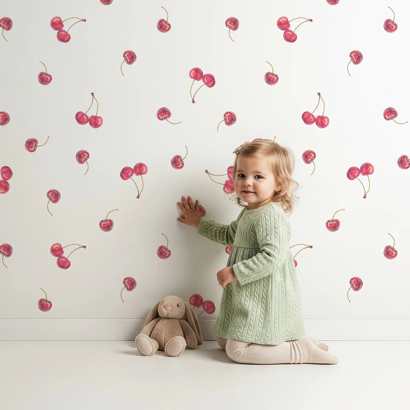 Lovely child standing in front of Whimsy Tots Watercolor Cherry Sprinkle Wallpaper with cherry, fruit, red, watercolor, food in design.