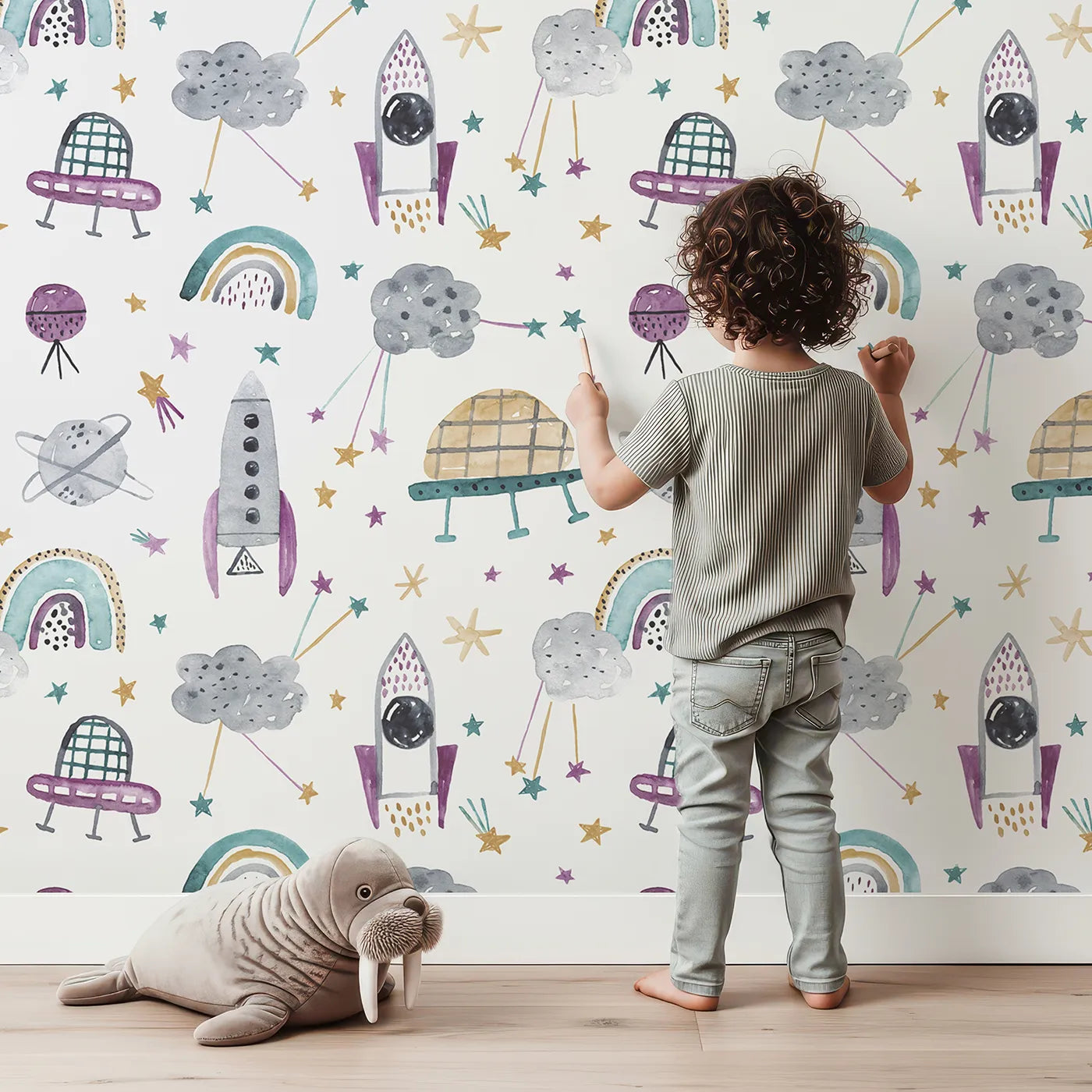 Lovely child standing in front of Whimsy Tots Watercolor Space Rainbows Wallpaper with space, rocket, rainbow, watercolor, planet in design.