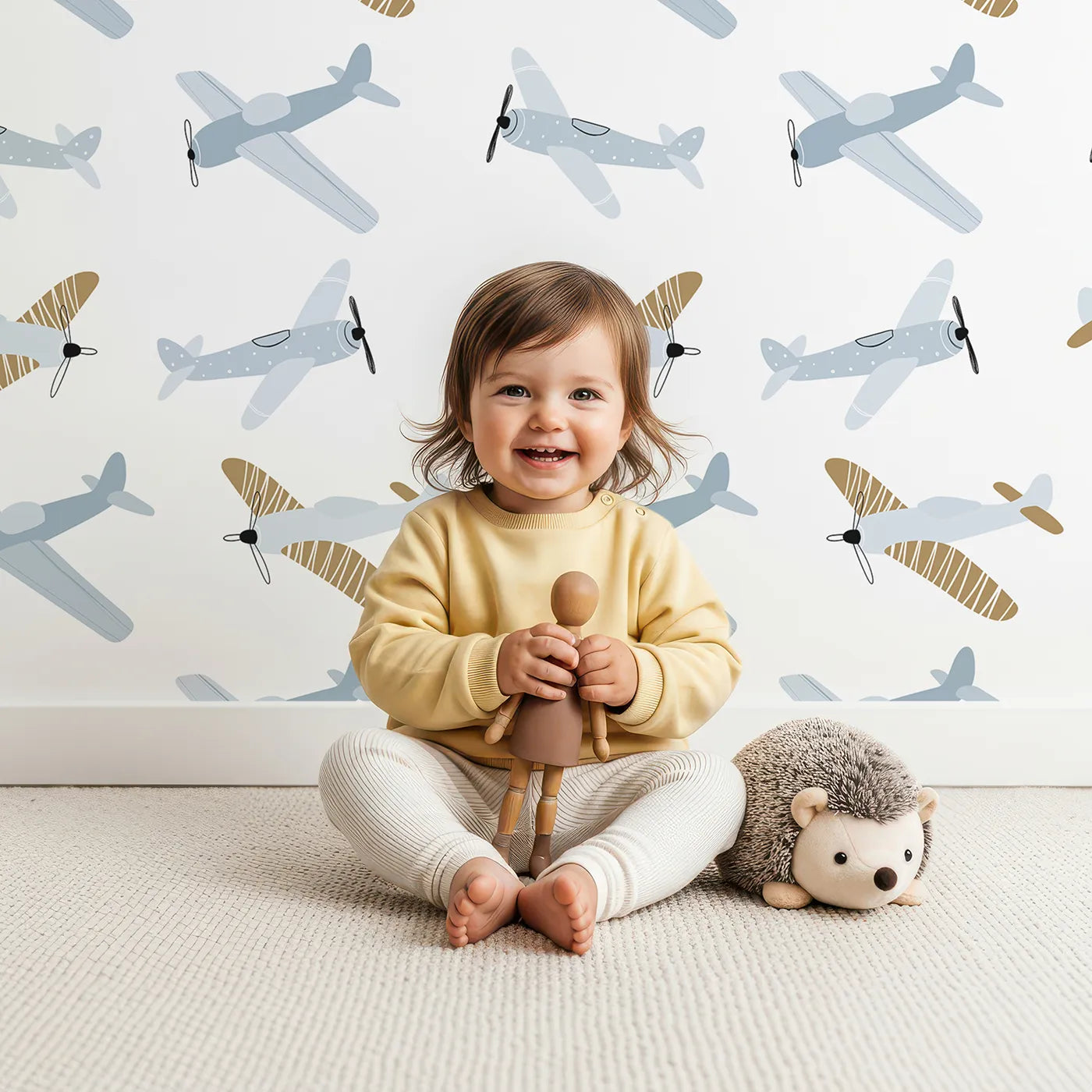 Lovely child standing in front of Whimsy Tots Vintage Propeller Planes Wallpaper with plane, airplane, vintage, sky, propeller in design.