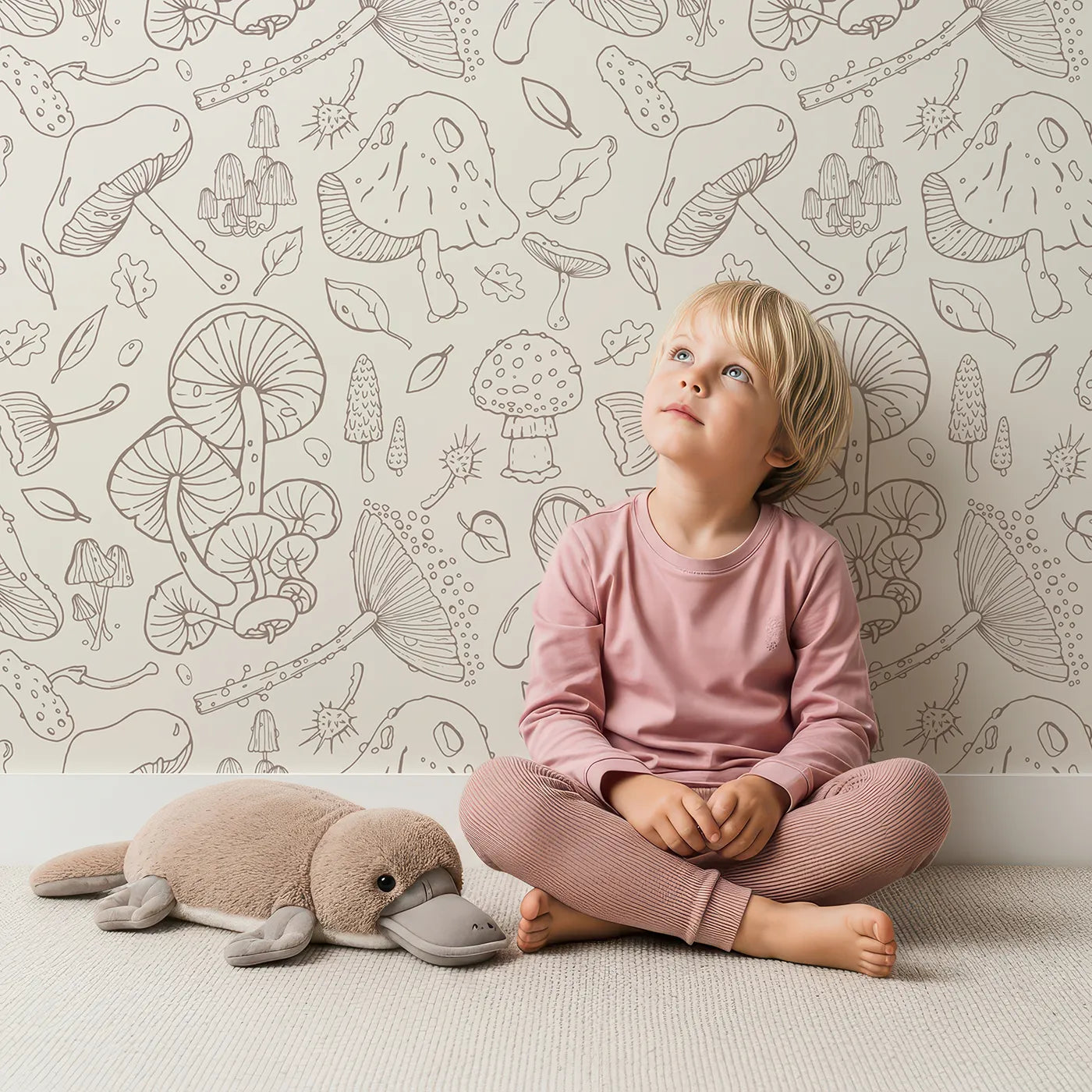 Lovely child standing in front of Whimsy Tots Mushroom Doodle Study Wallpaper with mushroom, doodle, sketch, botanical, forest in design.