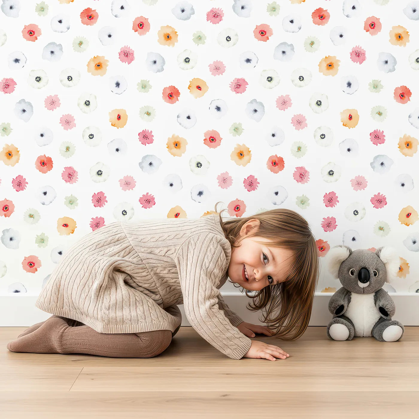 Lovely child standing in front of Whimsy Tots Watercolor Poppy Scatter Wallpaper with flower, poppy, watercolor, abstract, floral in design.
