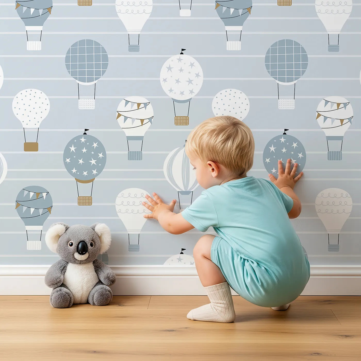 Lovely child standing in front of Whimsy Tots Striped Sky Balloon Ride Wallpaper with hot air balloon, sky, stripe, blue, adventure in design.