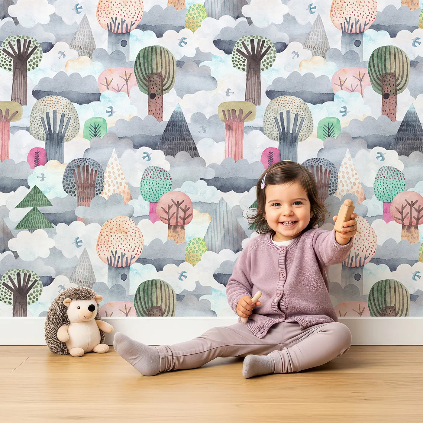 Lovely child standing in front of Whimsy Tots Cloudy Forest Dreamscape Wallpaper with forest, tree, cloud, sky, watercolor in design.