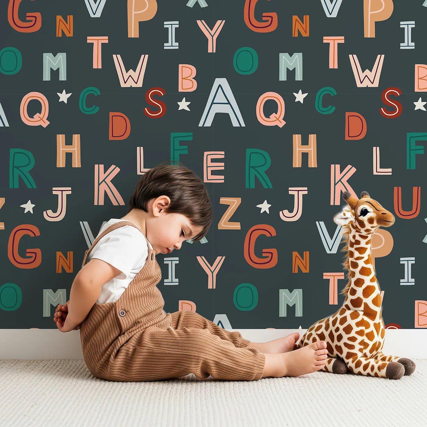 Lovely child standing in front of Whimsy Tots Boho Starry Alphabet Wallpaper with alphabet, letter, boho, star, learning in design.
