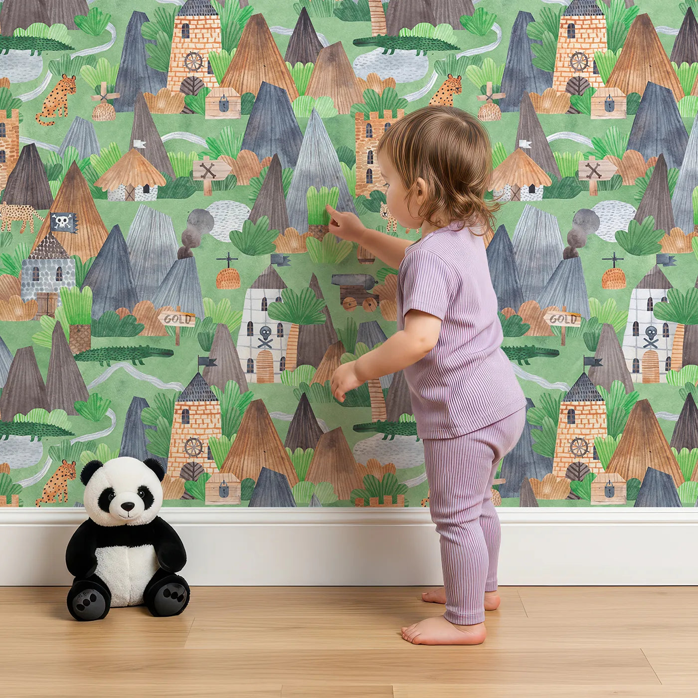 Lovely child standing in front of Whimsy Tots Watercolor Pirate Island Wallpaper with pirate, island, map, treasure, jungle in design.