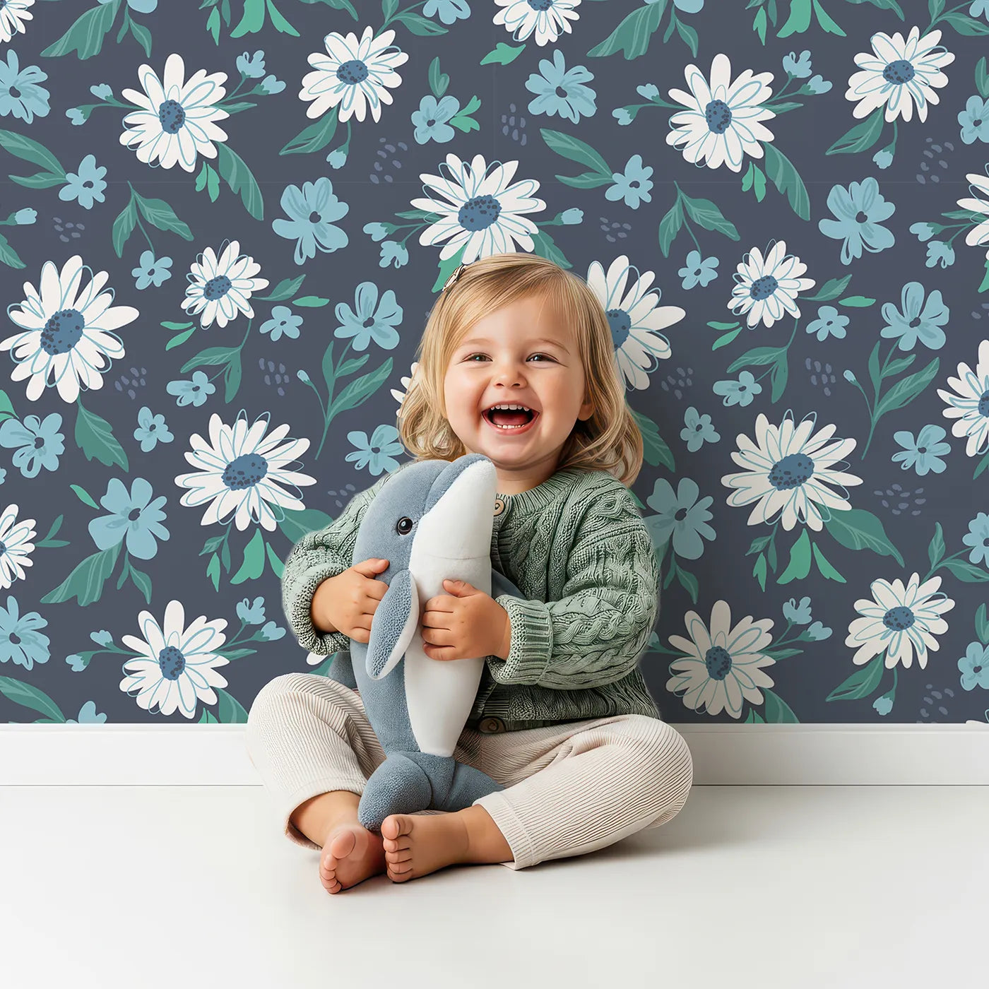 Lovely child standing in front of Whimsy Tots Midnight Daisy Field Wallpaper with daisy, flower, floral, navy, blue in design.