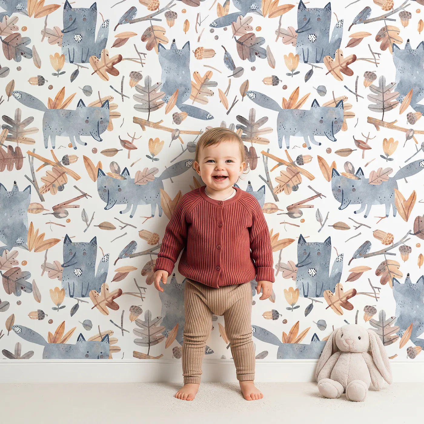 Lovely child standing in front of Whimsy Tots Playful Autumn Fox Wallpaper with fox, autumn, leaf, watercolor, woodland in design.