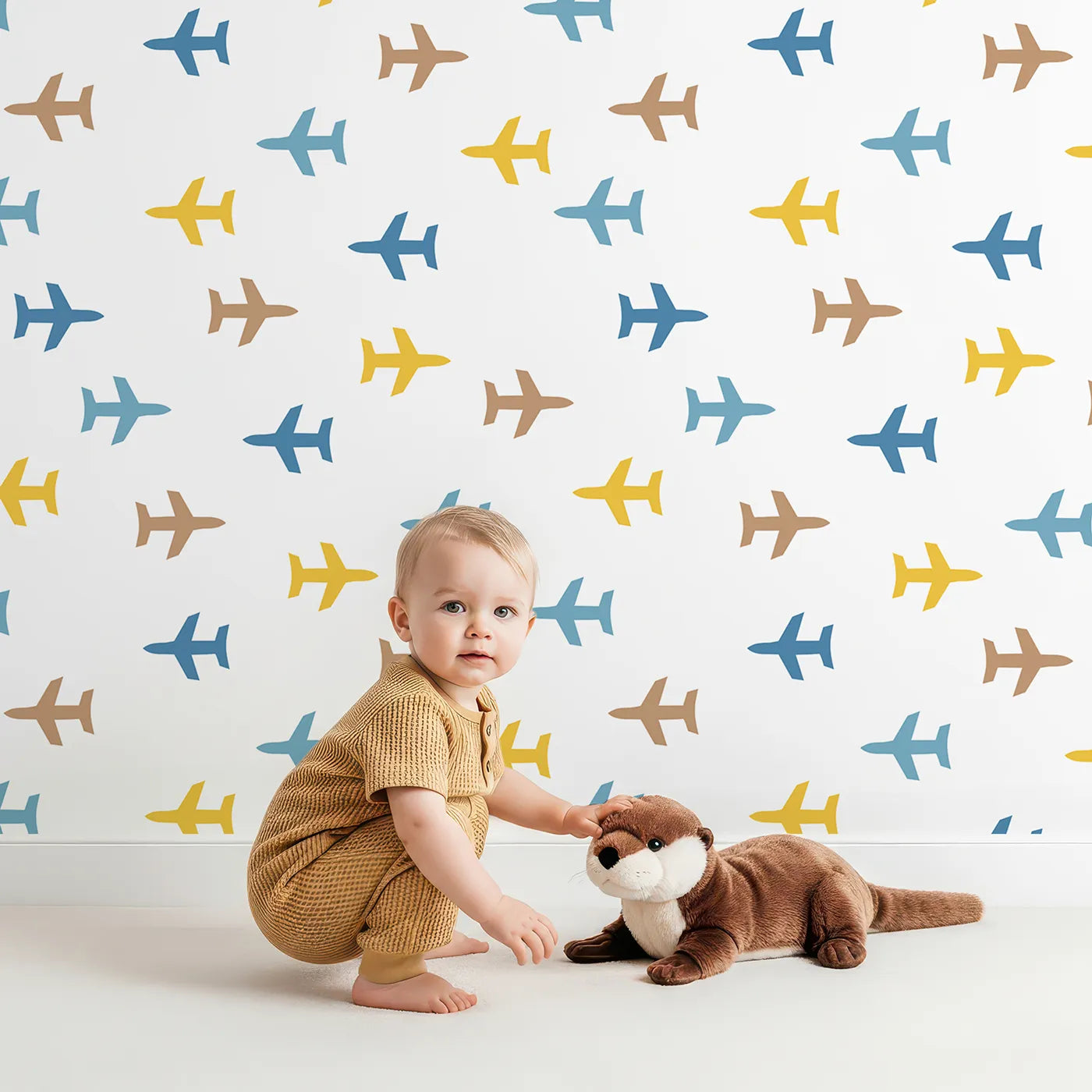 Lovely child standing in front of Whimsy Tots Minimalist Airplane Scatter Wallpaper with plane, airplane, minimalist, colorful, sky in design.
