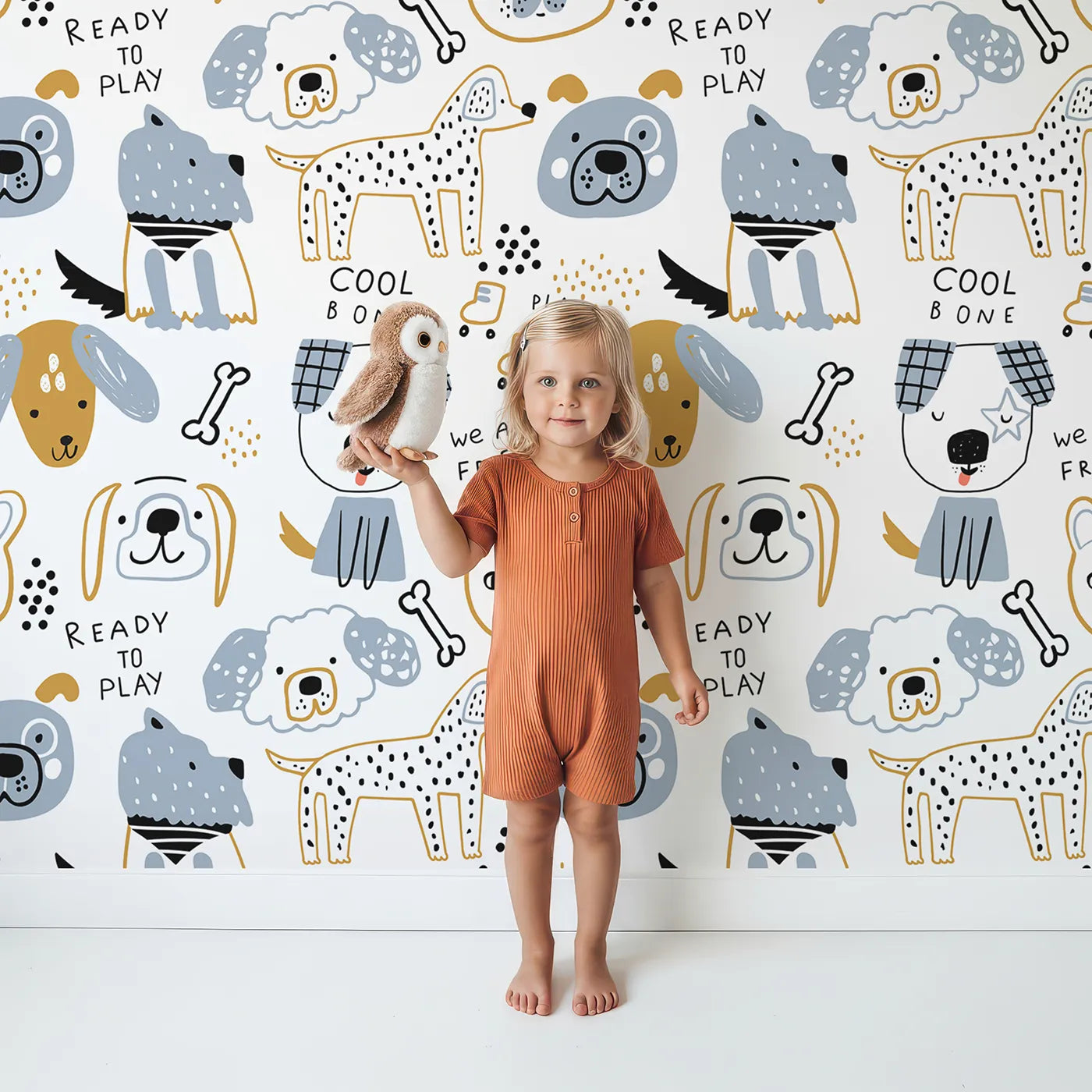 Lovely child standing in front of Whimsy Tots Playful Puppy Portraits Wallpaper with dog, puppy, doodle, modern, cute in design.