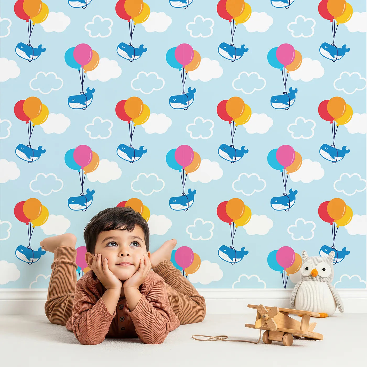 Lovely child standing in front of Whimsy Tots Whale Balloon Sky Ride Wallpaper with whale, balloon, sky, cloud, cute in design.