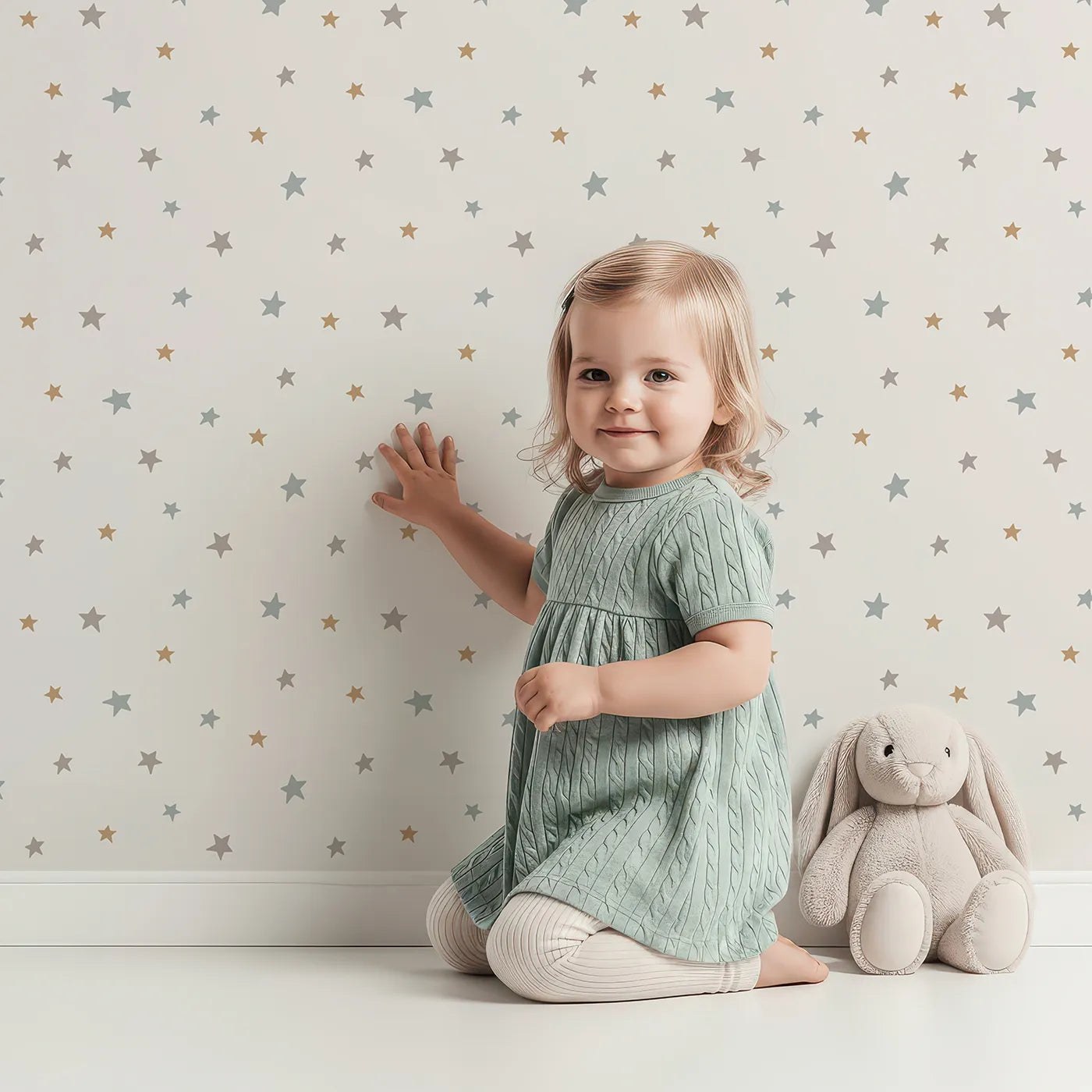 Lovely child standing in front of Whimsy Tots Neutral Starry Sky Wallpaper with star, sky, neutral, minimalist, space in design.