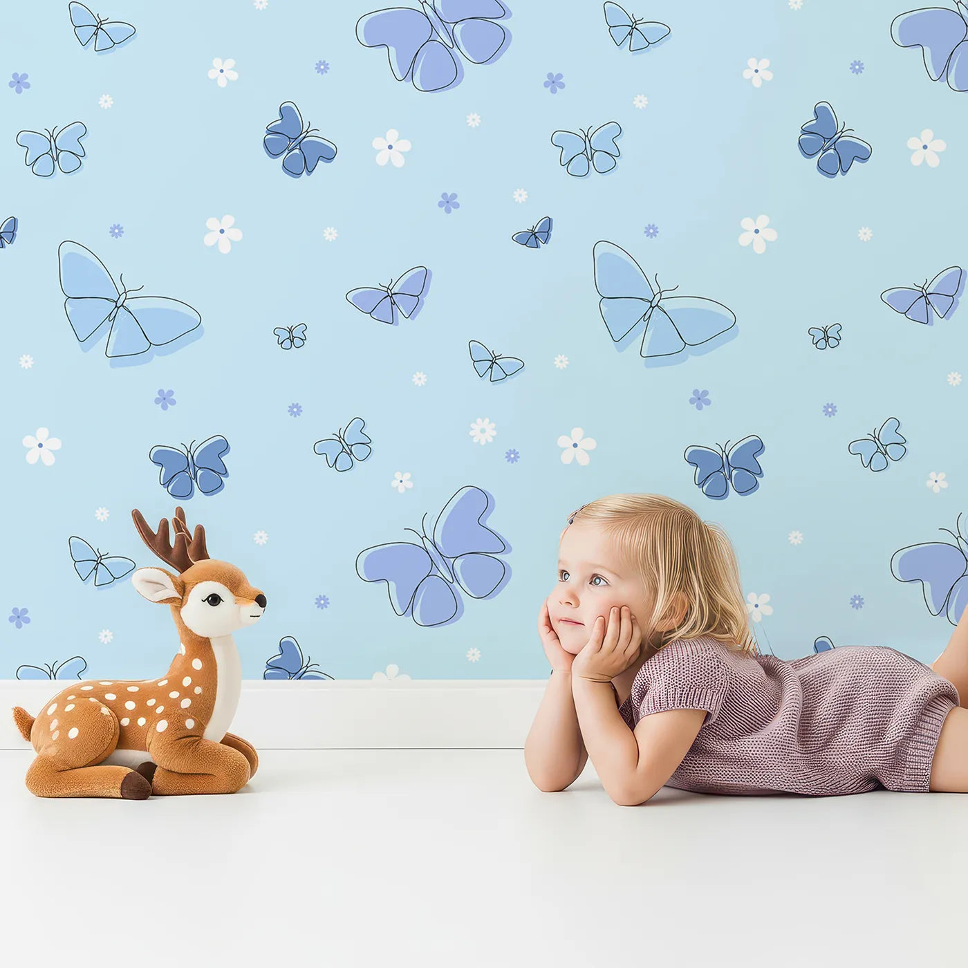 Lovely child standing in front of Whimsy Tots Minimalist Butterfly Garden Wallpaper in Blue with butterfly, flower, minimalist, blue, line art in design.
