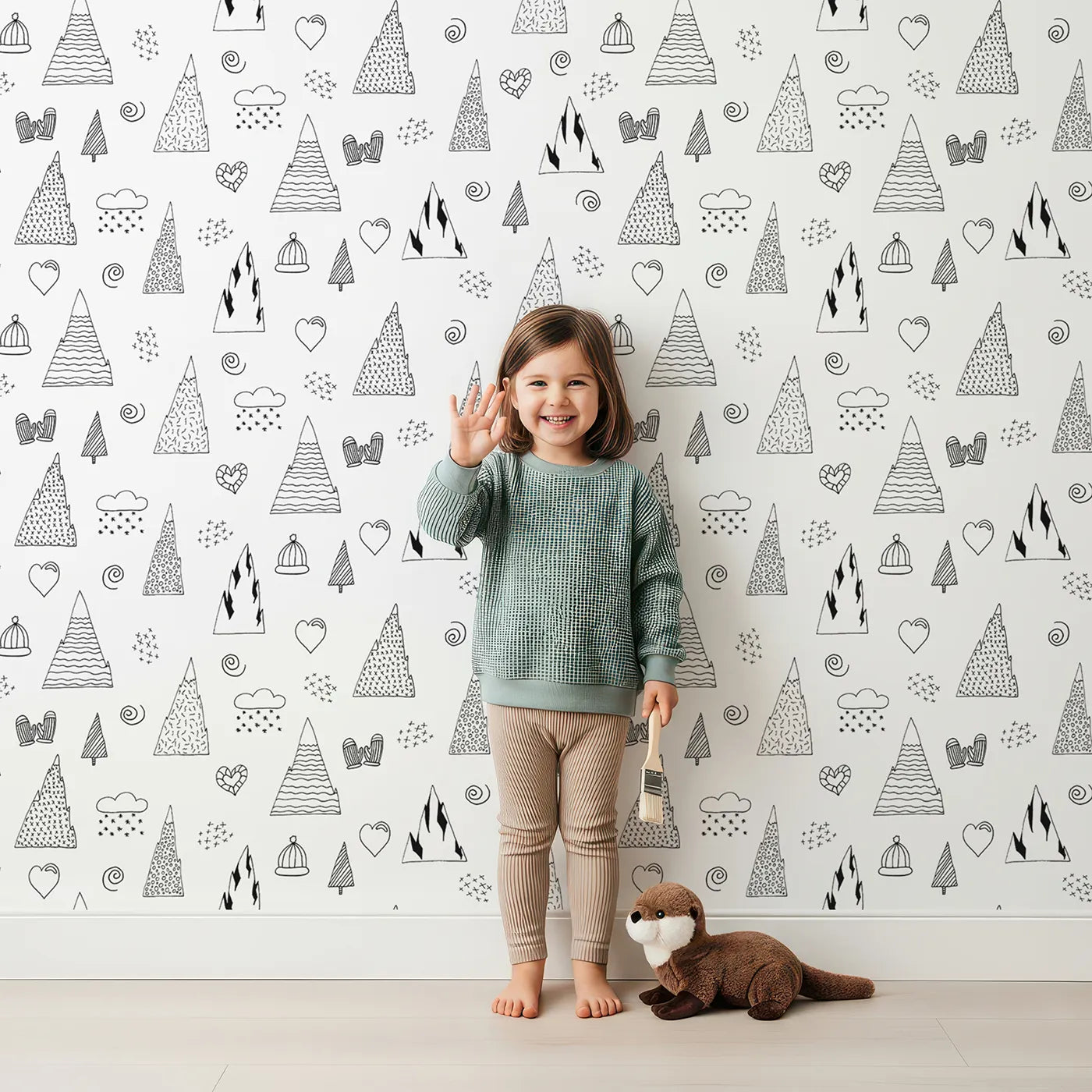 Lovely child standing in front of Whimsy Tots Winter Mountain Doodle Wallpaper with winter, mountain, doodle, snow, heart in design.