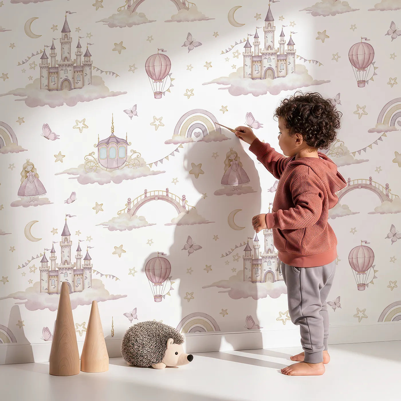 Lovely child standing in front of Whimsy Tots Princess Sky Kingdom Wallpaper with princess, castle, cloud, watercolor, fairytale in design.
