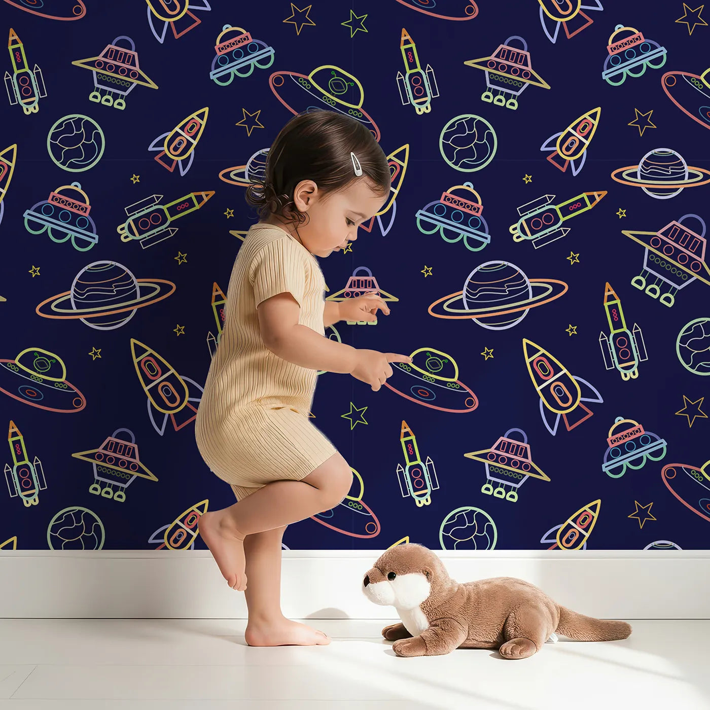Lovely child standing in front of Whimsy Tots Neon Outline Space Wallpaper with space, neon, rocket, ufo, outline in design.