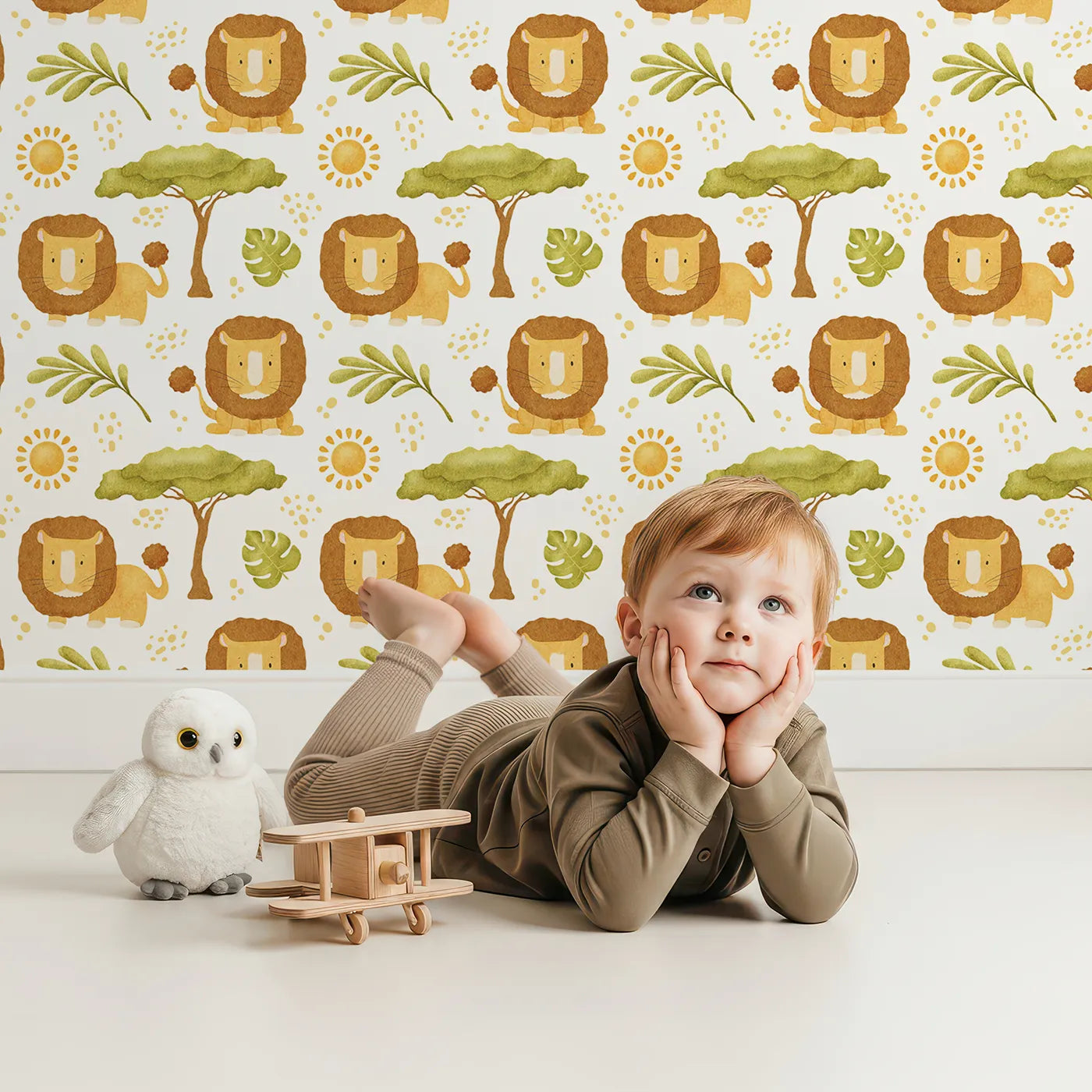 Lovely child standing in front of Whimsy Tots Watercolor Lion Savanna Wallpaper with lion, safari, savanna, watercolor, sun in design.