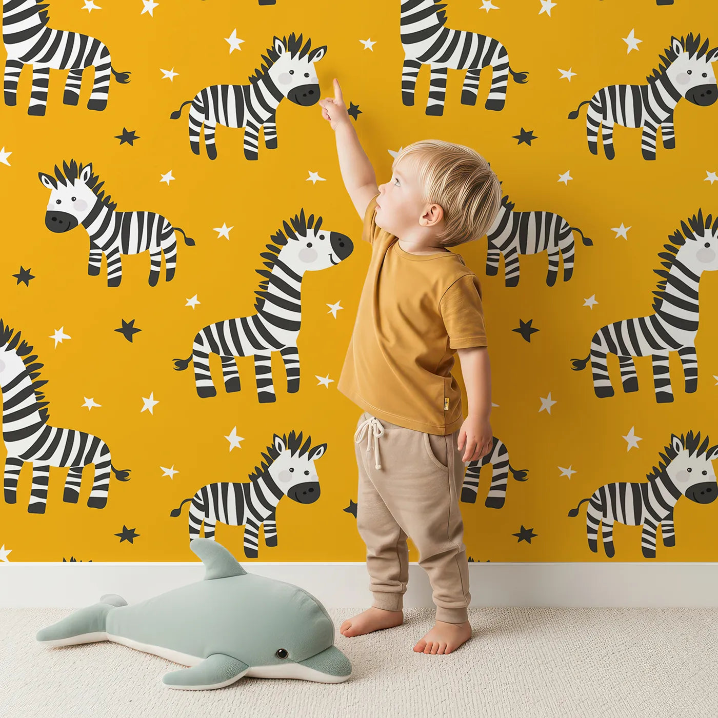 Lovely child standing in front of Whimsy Tots Starry Zebra Stripes Wallpaper in Yellow with zebra, star, yellow, safari, animal in design.