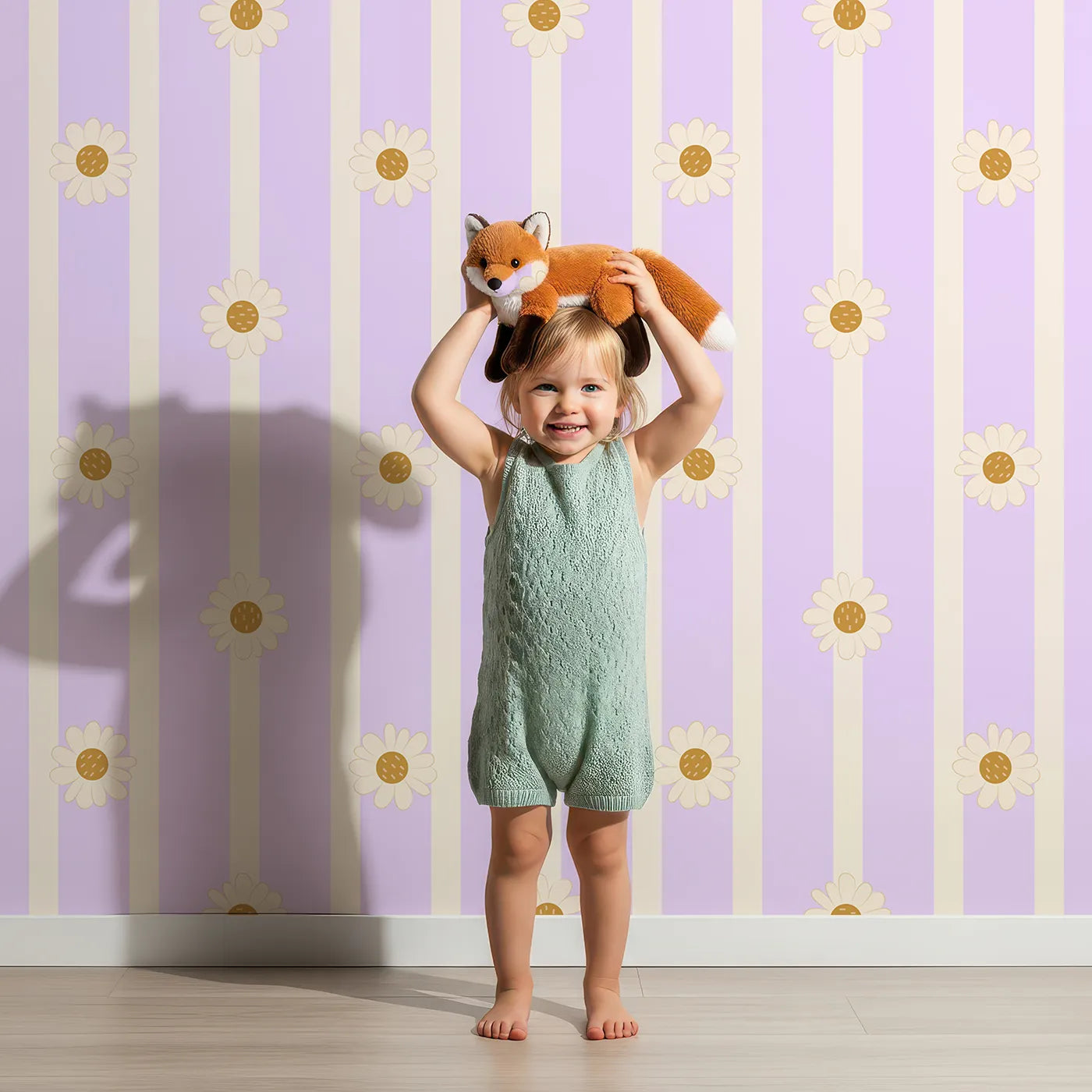 Lovely child standing in front of Whimsy Tots Daisy Lane Stripe Wallpaper in Purple with daisy, flower, stripe in design.