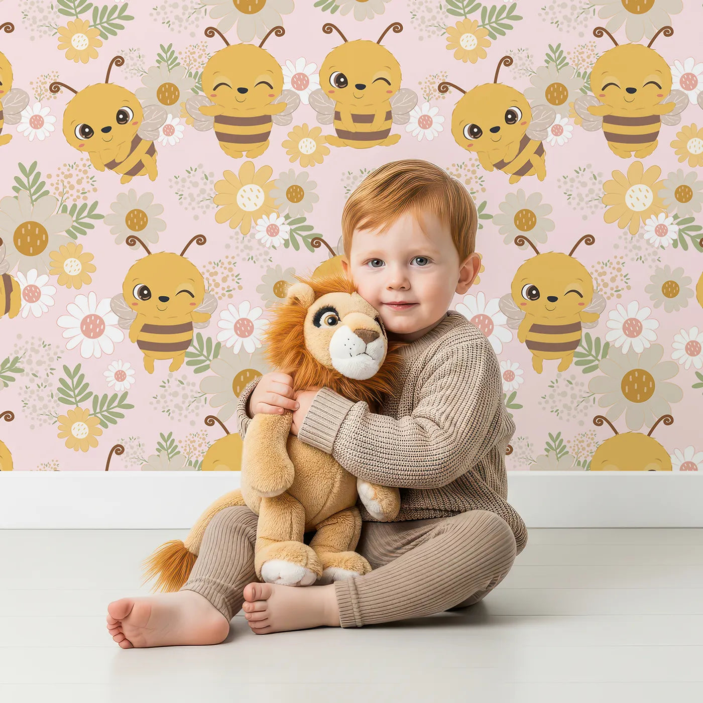 Lovely child standing in front of Whimsy Tots Bee Garden Blooms Wallpaper in Pink with bee, flower, daisy, leaf in design.