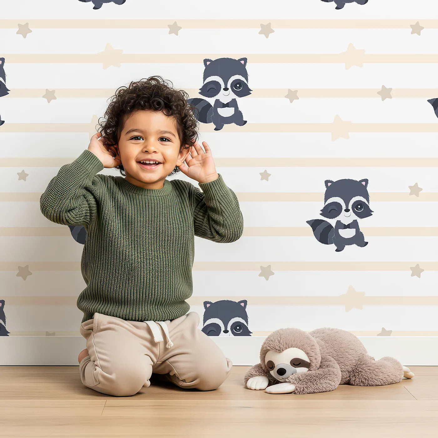 Lovely child standing in front of Whimsy Tots Starlit Raccoon Stripes Wallpaper in Cream with raccoon, star, stripe in design.