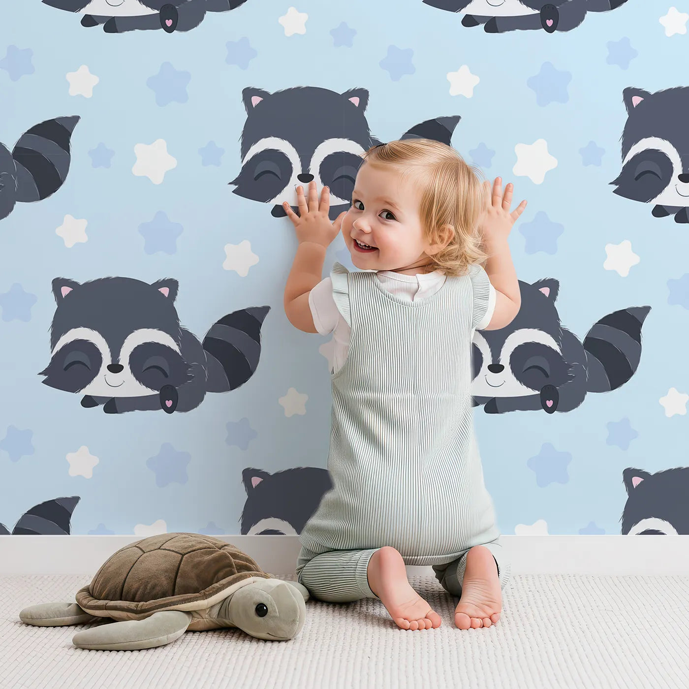 Lovely child standing in front of Whimsy Tots Raccoon Dream Stars Wallpaper in Blue with raccoon, star in design.