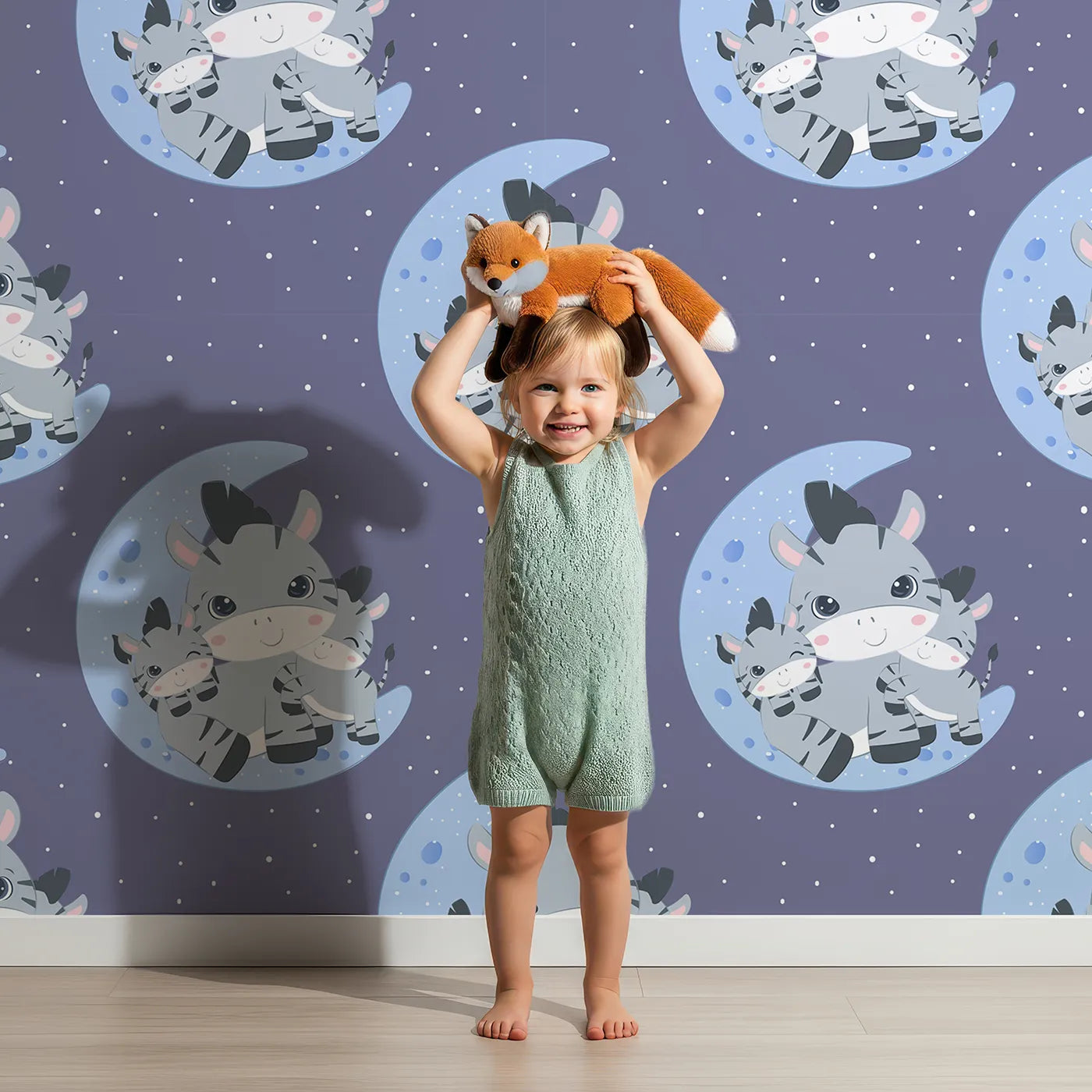 Lovely child standing in front of Whimsy Tots Moon Cuddles Zebra Wallpaper in Navy Blue with zebra, moon, star in design.