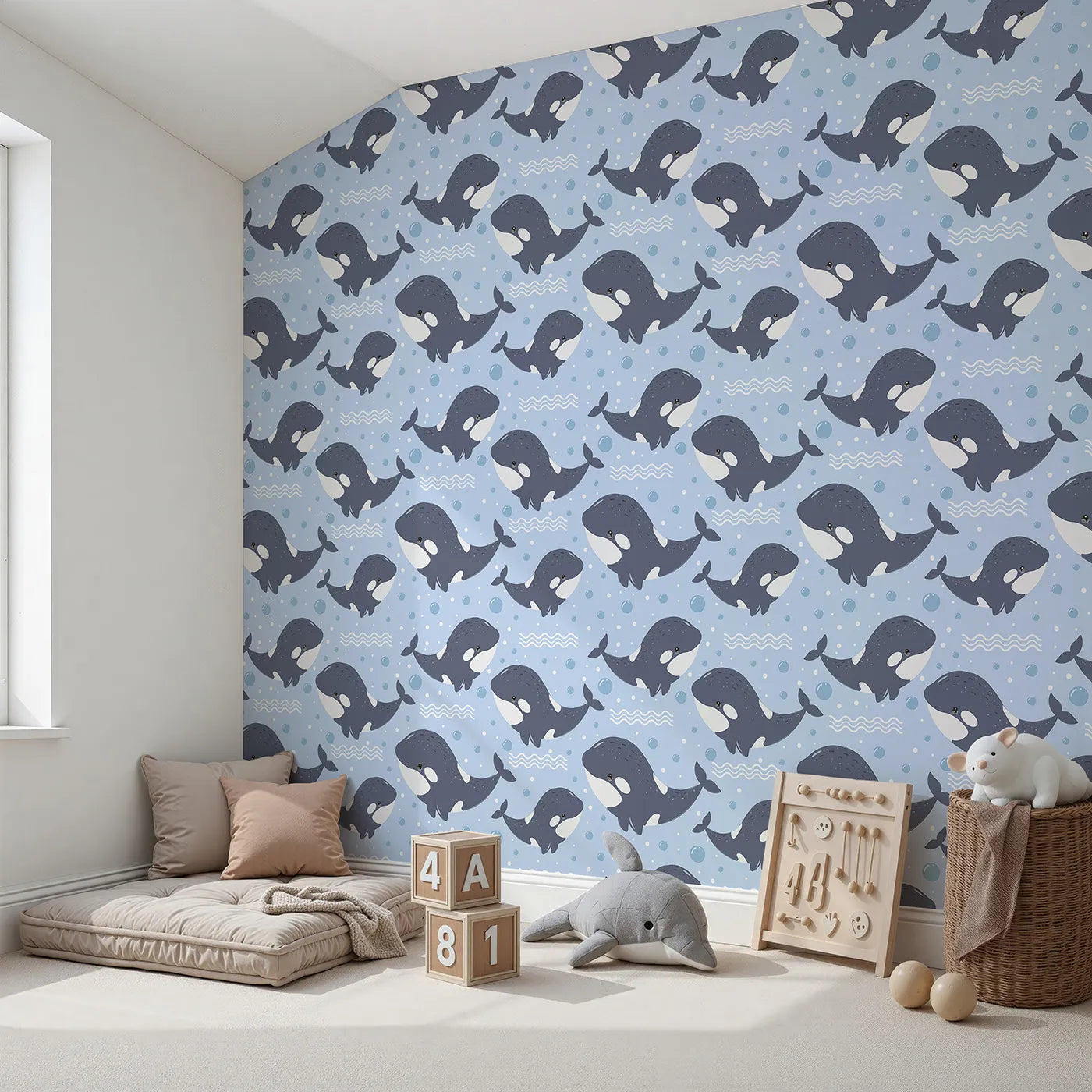 Angled view of Whimsy Tots' Orca Whale Wonder Wallpaper in Blue (W3045A).Smiling orcas splash through bubbly blue waves.