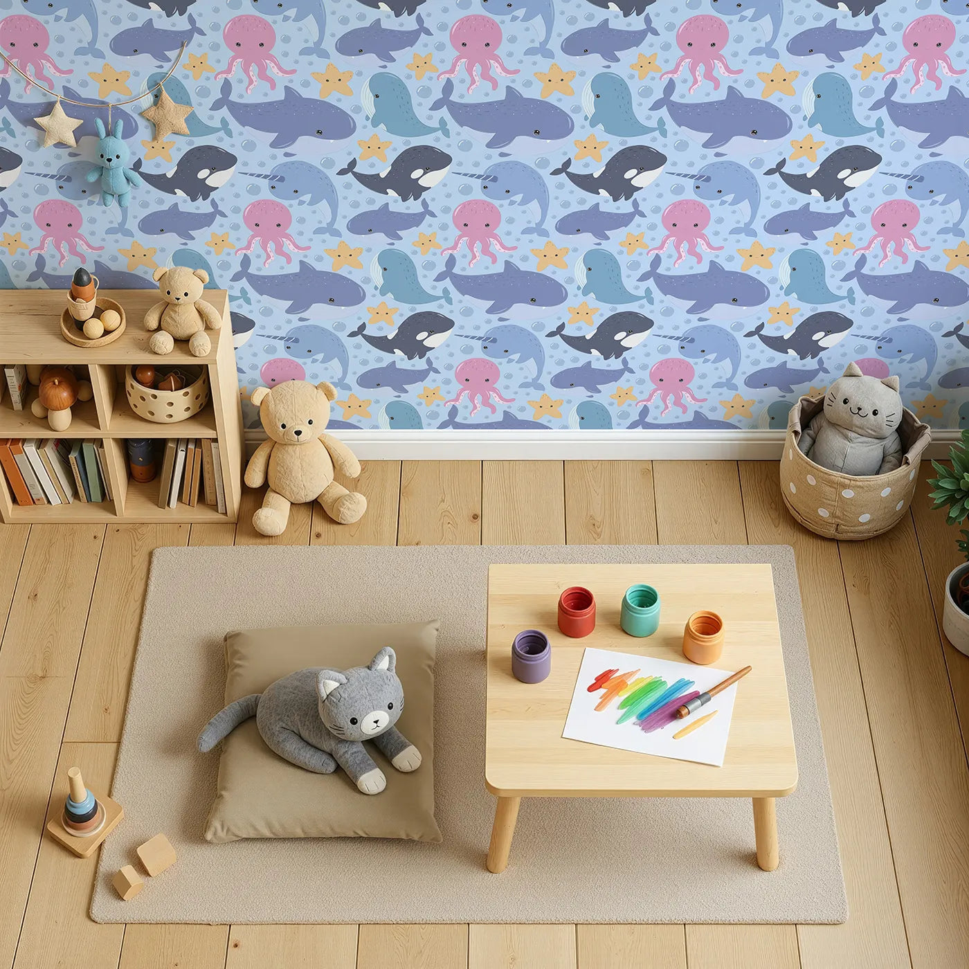 Top-Down view of Whimsy Tots' Ocean Buddy Parade Wallpaper in Blue (W3046E).Playful sea animals float and splash through a gentle ocean blue.