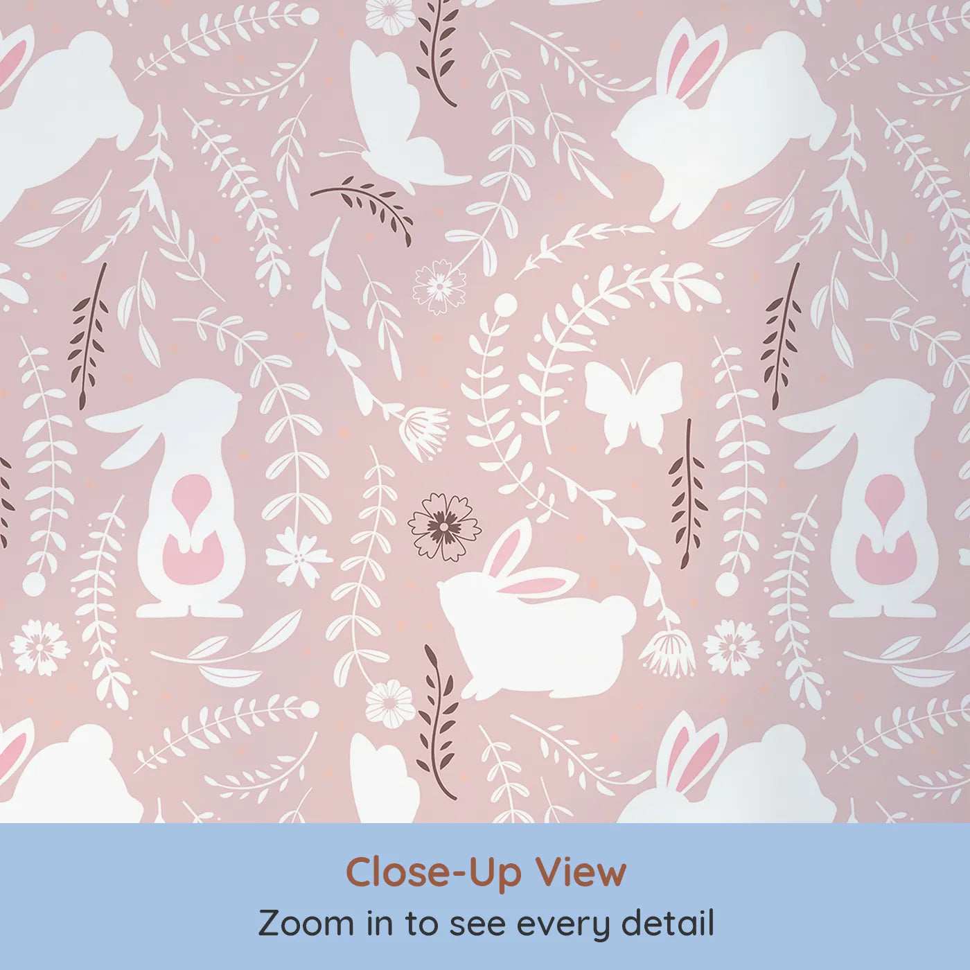 Close-up view of Whimsy Tots' Bunny Hideaway Meadow Wallpaper in Blush Pink (W3050B).White bunnies hop among soft vines and floral silhouettes on a gentle blush field.