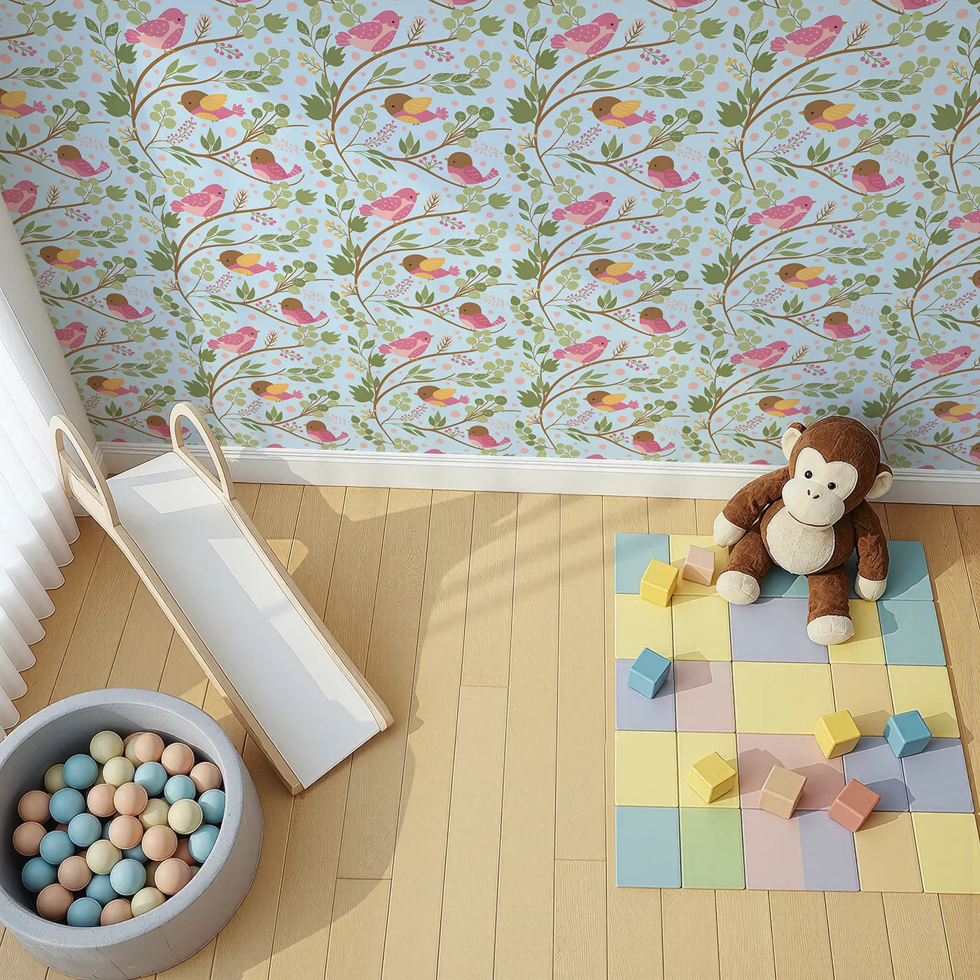 Top-Down view of Whimsy Tots' Blossom Branch Birds Wallpaper in Sky Blue (W3070D).Soft pink birds and leafy branches bloom over a clear sky blue field.
