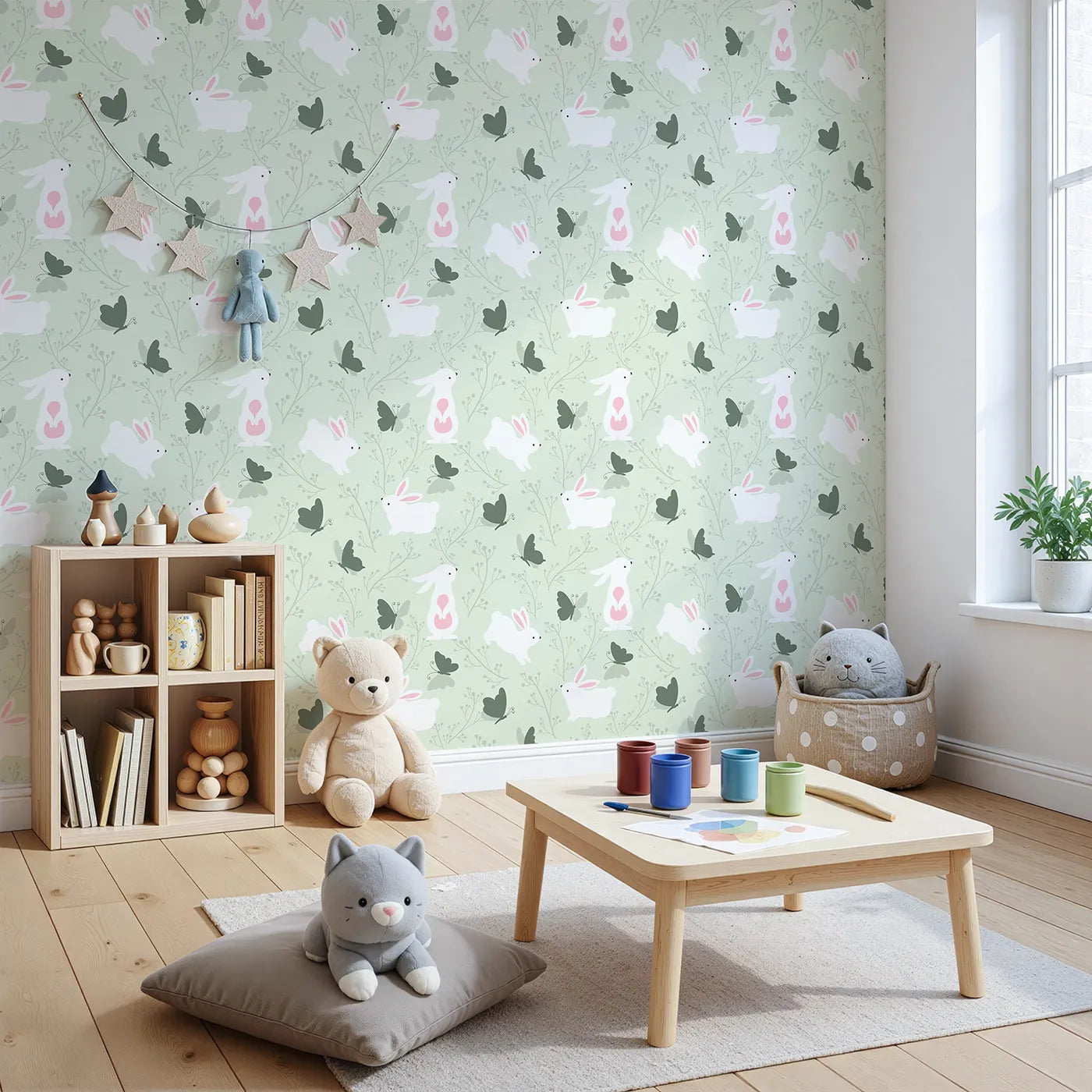 Angled view of Whimsy Tots' Bunny and Butterfly Meadow Wallpaper in Mint Green (W3074B).White bunnies and forest butterflies play among gentle green twigs.