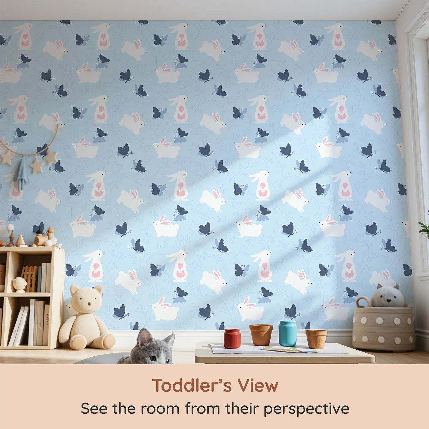 Whimsy Tots Bunny and Butterfly Meadow Wallpaper in Blue (W3074D) from your child's view.White bunnies and blue butterflies flutter through a peaceful field.