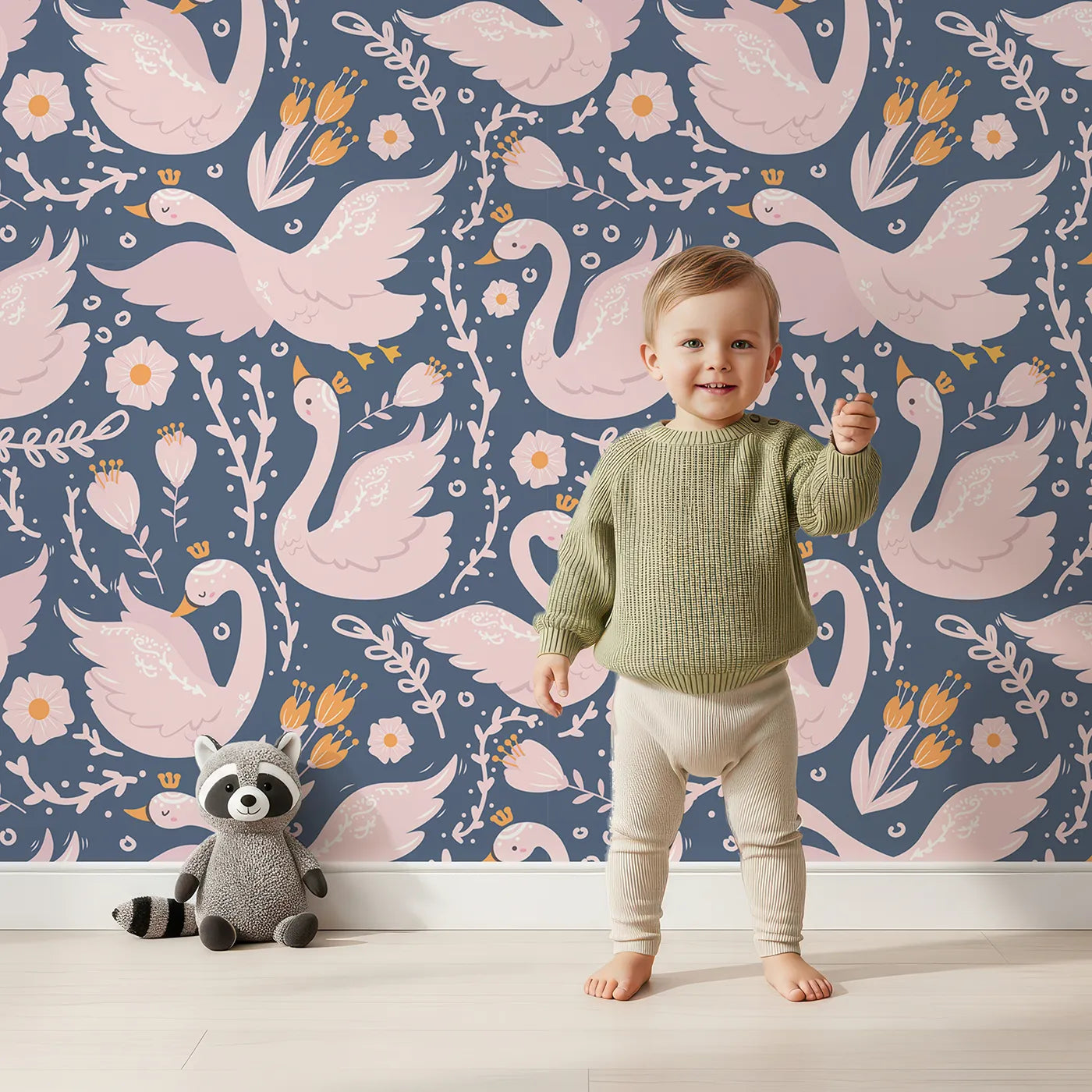 Lovely child standing in front of Whimsy Tots Starlit Swan Ballet Wallpaper in Navy Blue with swan, crown, flower, bow, leaf in design.