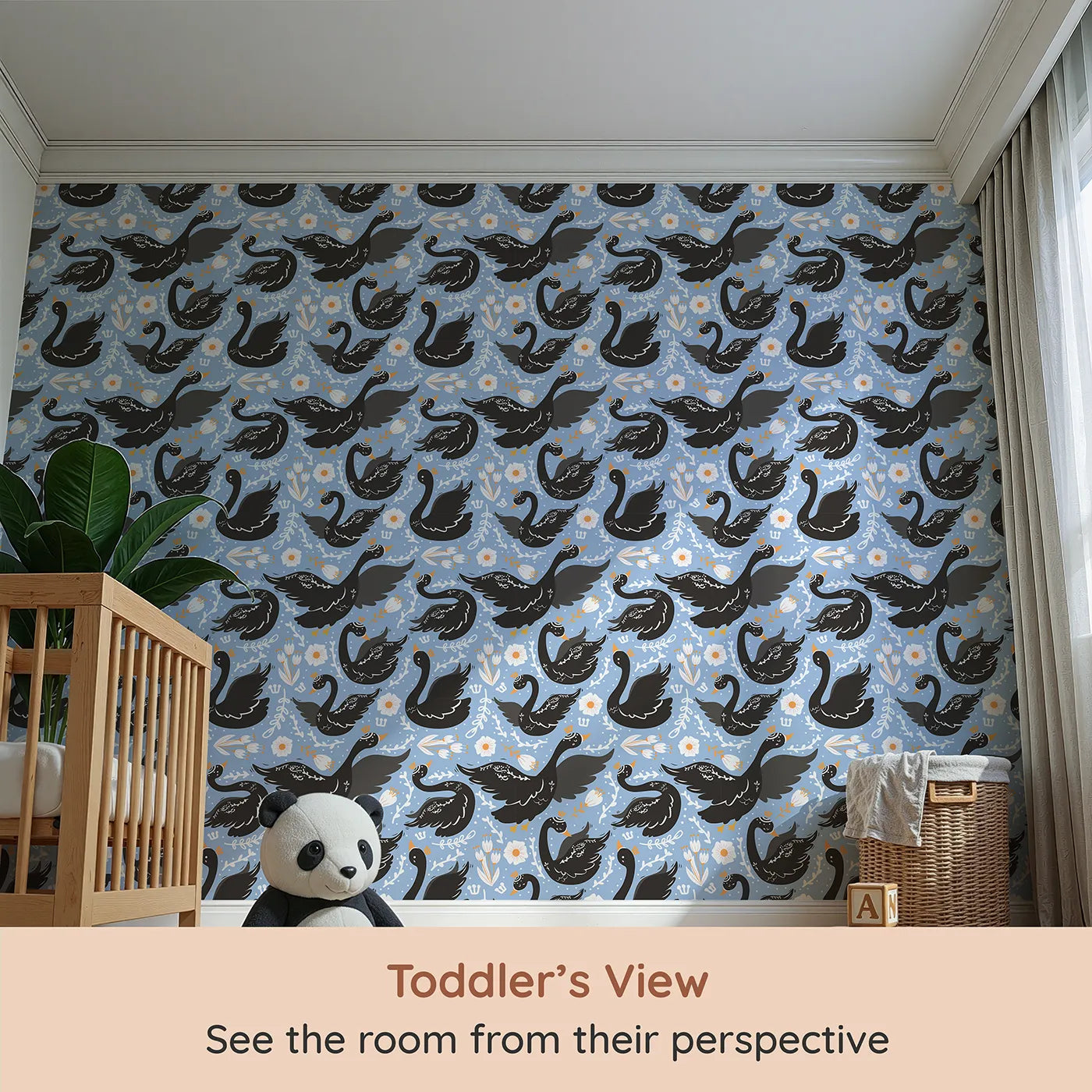 Whimsy Tots Regal Swan Parade Wallpaper in Sky Blue (W3087B) from your child's view.Crowned black swans flutter among blooms on a cheerful sky-blue canvas.