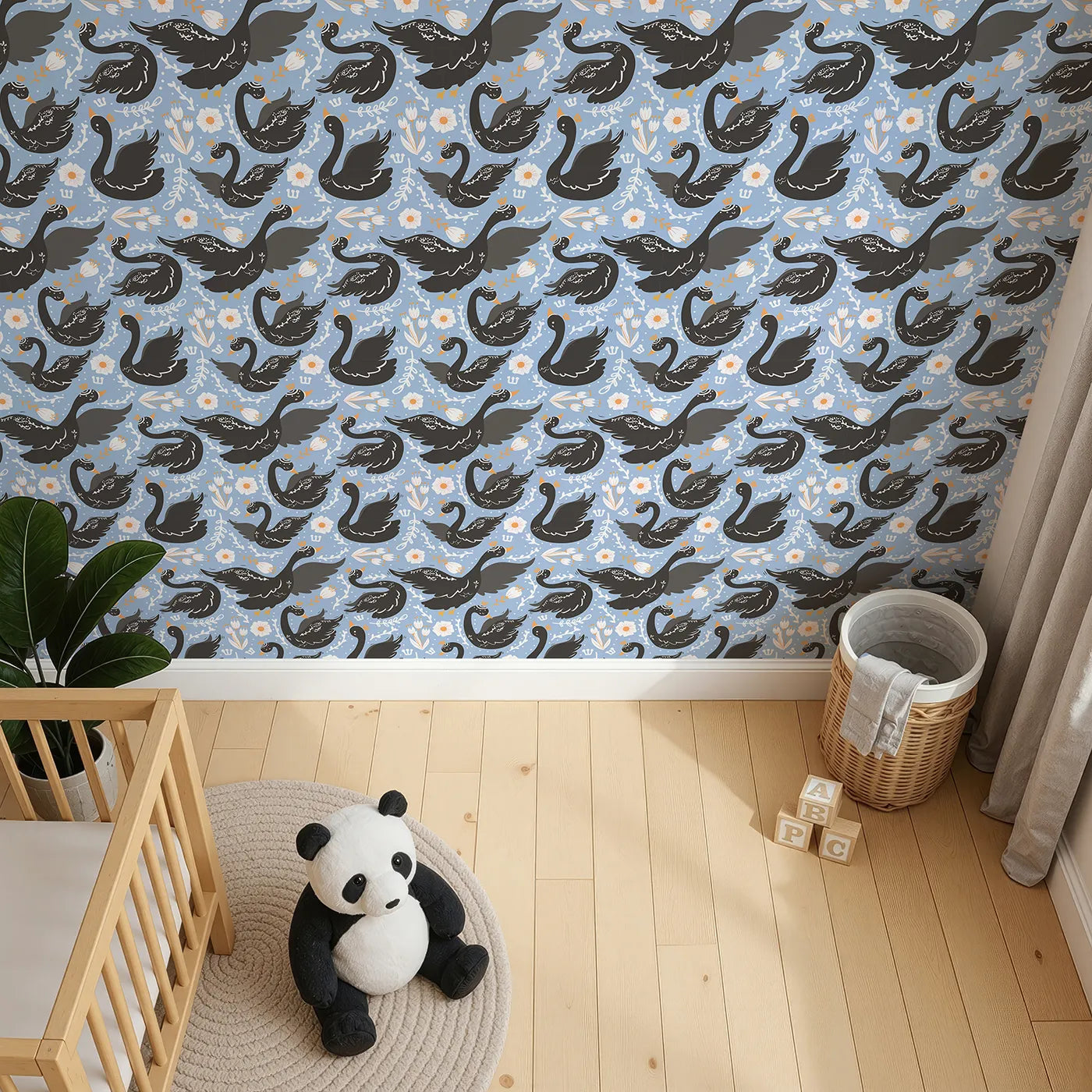 Top-Down view of Whimsy Tots' Regal Swan Parade Wallpaper in Sky Blue (W3087B).Crowned black swans flutter among blooms on a cheerful sky-blue canvas.