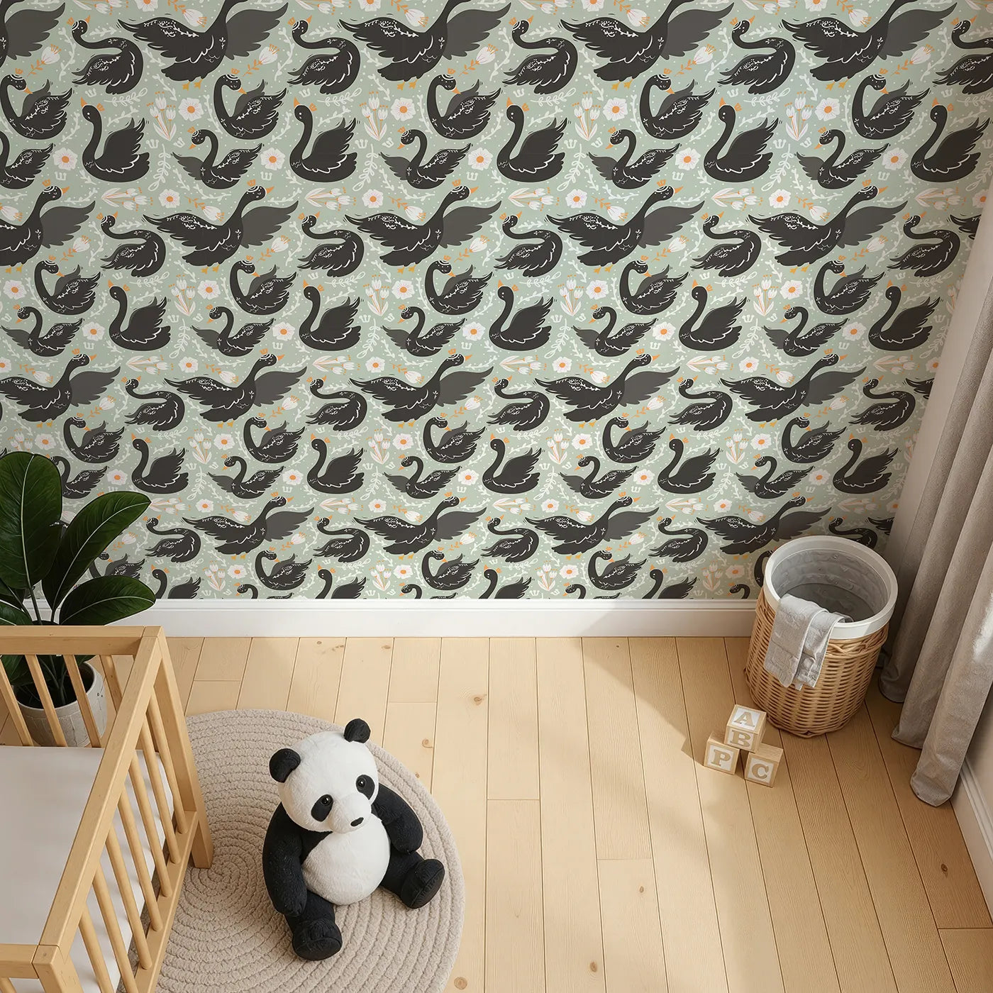 Top-Down view of Whimsy Tots' Regal Swan Parade Wallpaper in Sage Green (W3087D).Black swans with tiny crowns drift among flowers on a soft green breeze.
