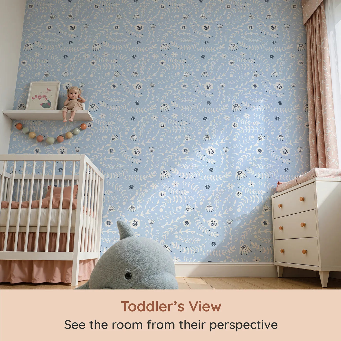 Whimsy Tots Spring Meadow Whispers Wallpaper in Sky Blue (W3089C) from your child's view.White florals float through a soft, sky-blue breeze.